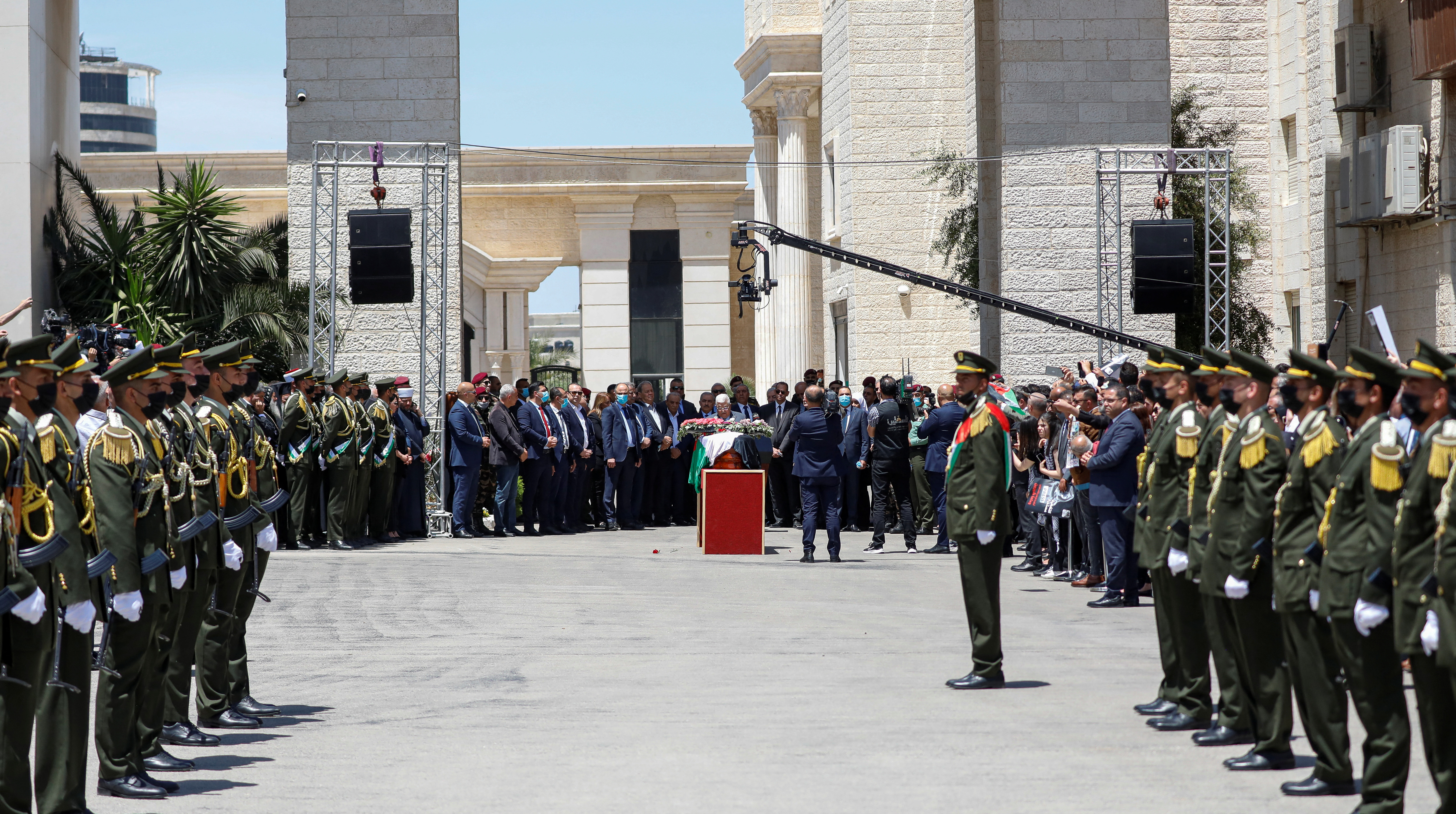 Palestinians attend a state service for veteran Al-Jazeera journalist Shireen Abu Akleh