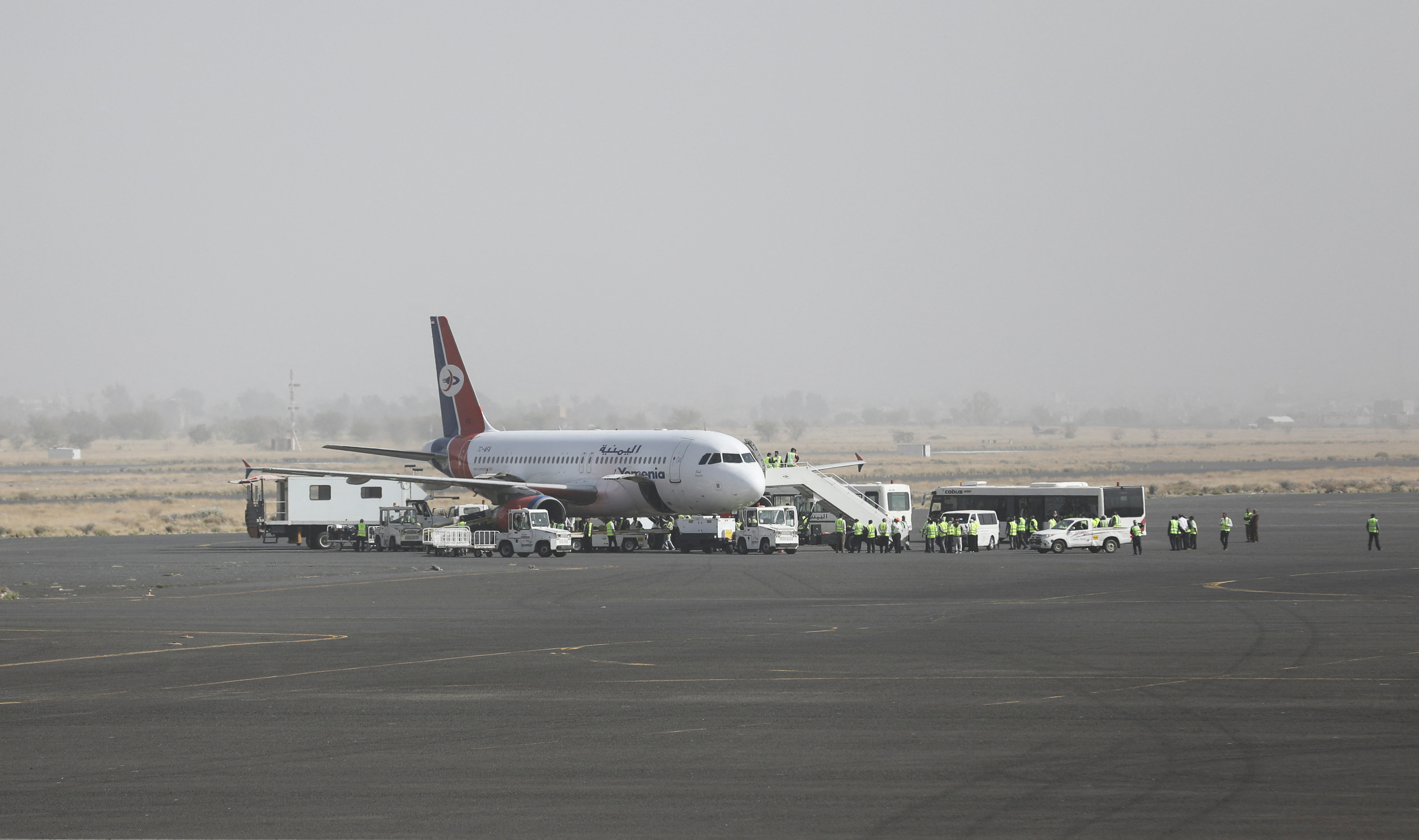 A Yemen Airways plane is prepared for departure at Sanaa Airport as the first commercial flight from the airport in around six years, in Sanaa