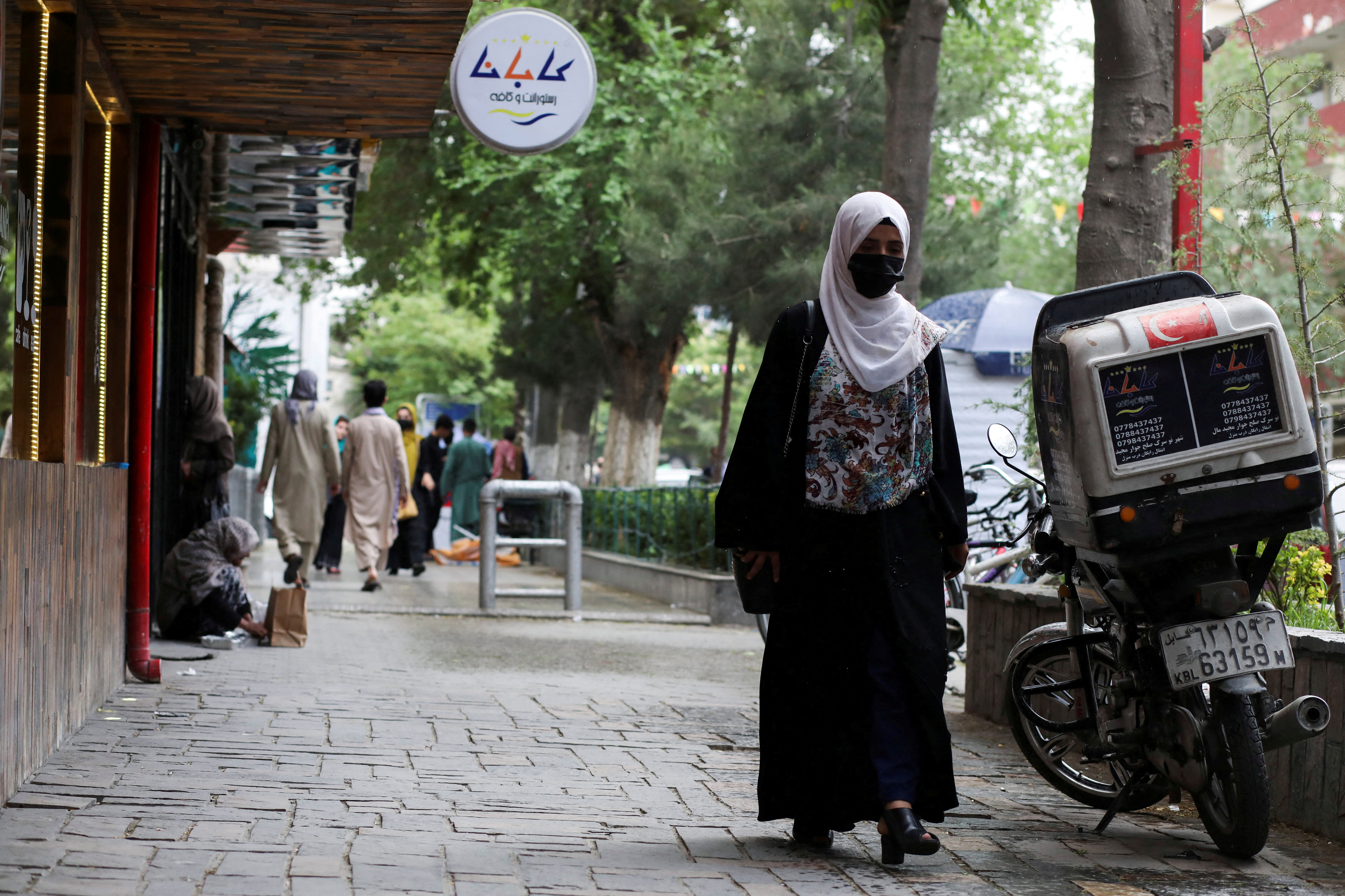 FILE PHOTO: An Afghan woman walks on a street in Kabul, Afghanistan,