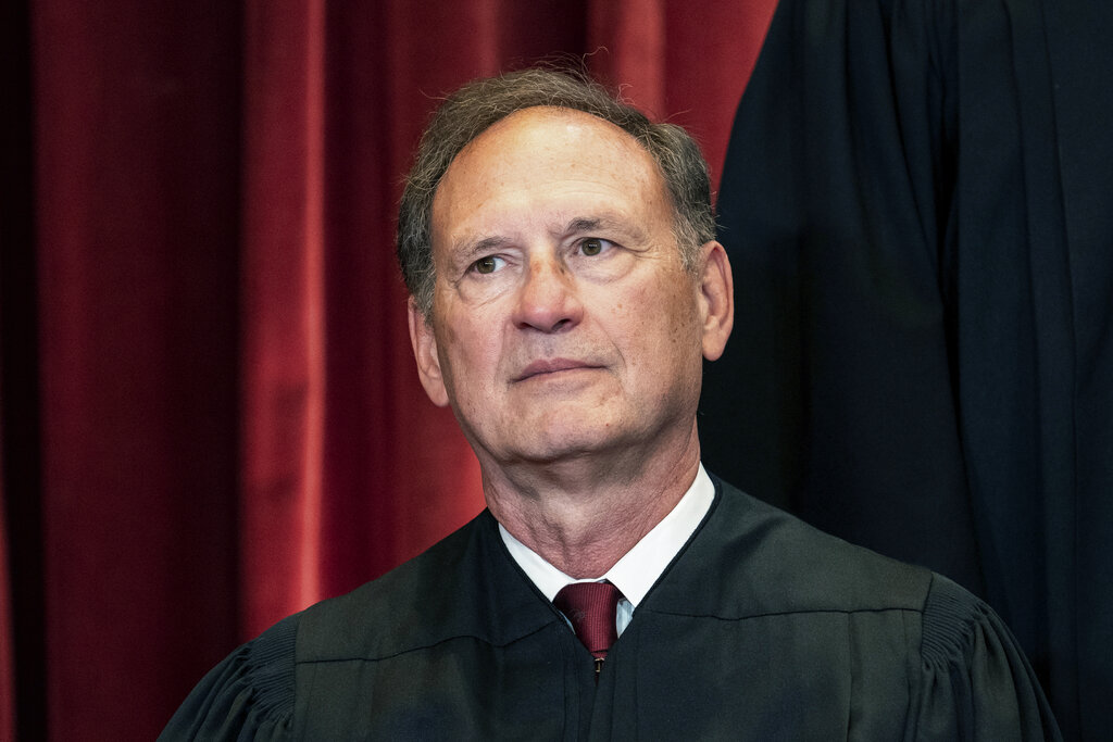 Associate Justice Samuel Alito sits during a group photo at the Supreme Court