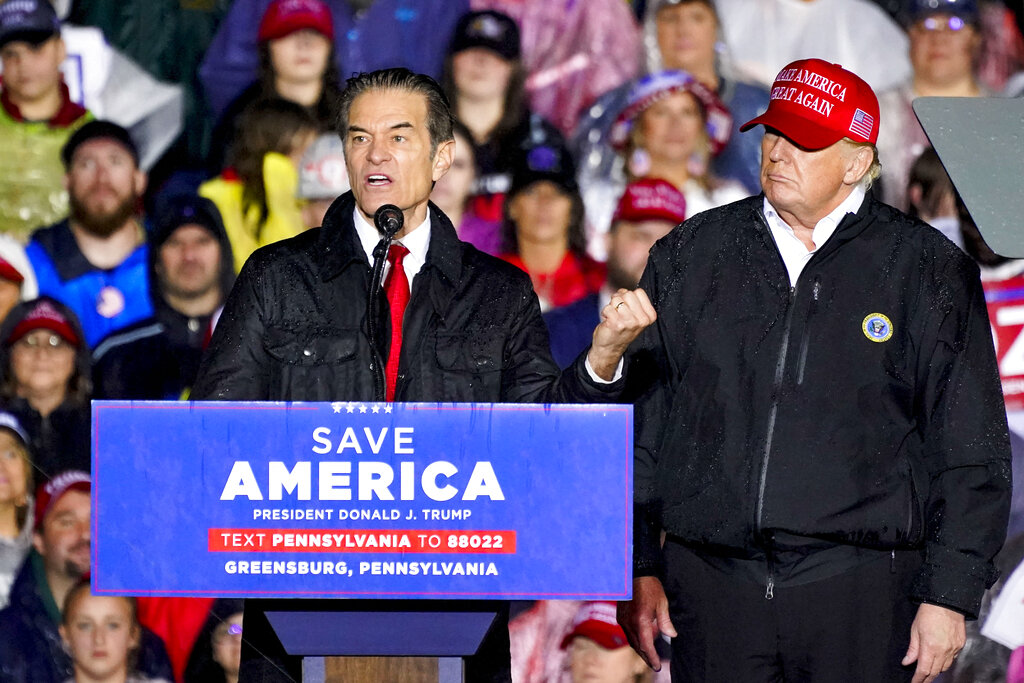 Pennsylvania Senate candidate Mehmet Oz, left, accompanied by former President Donald Trump, speaks at a campaign rally in Greensburg, Pa.