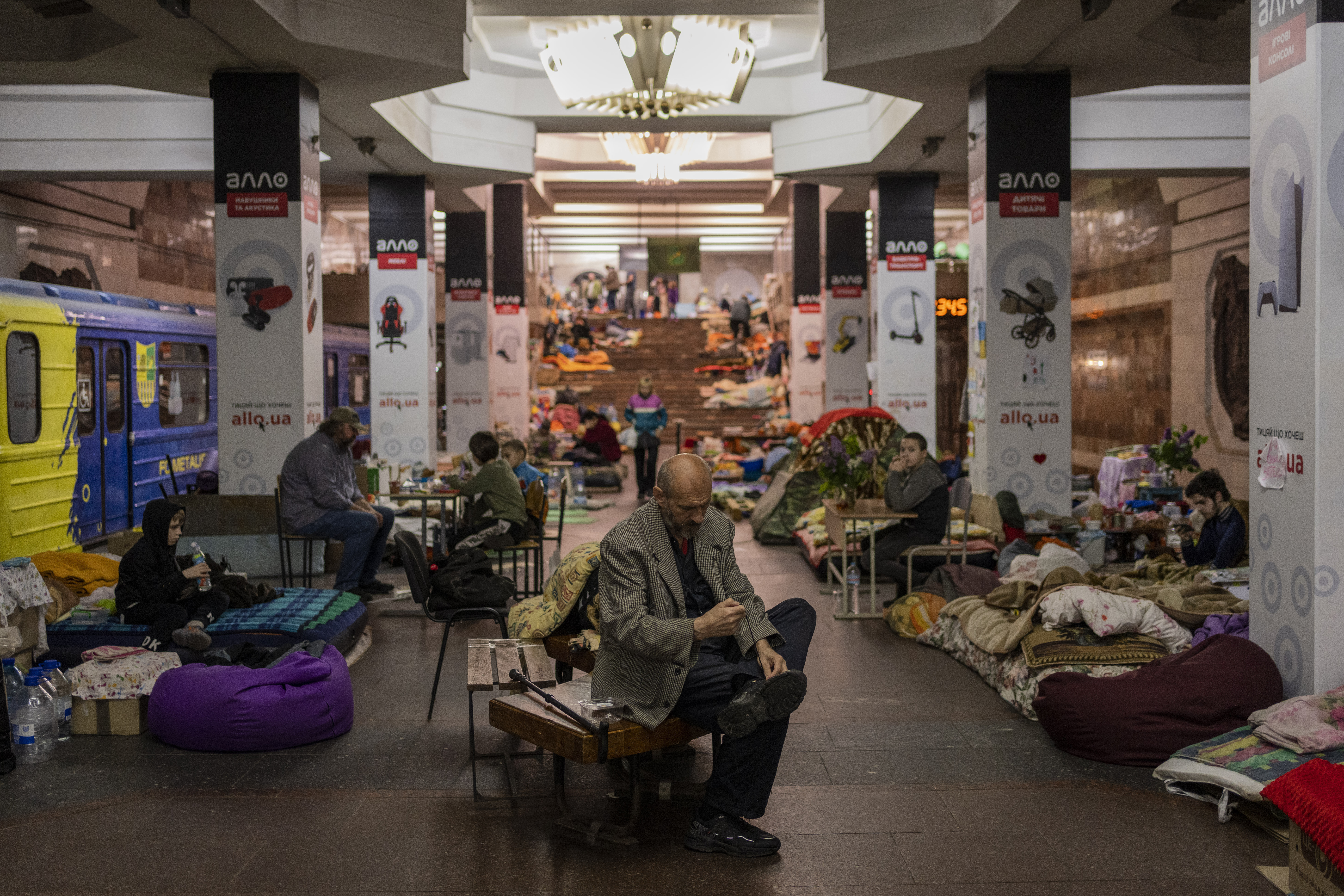 People take shelter in a metro station in the city of Kharkiv 