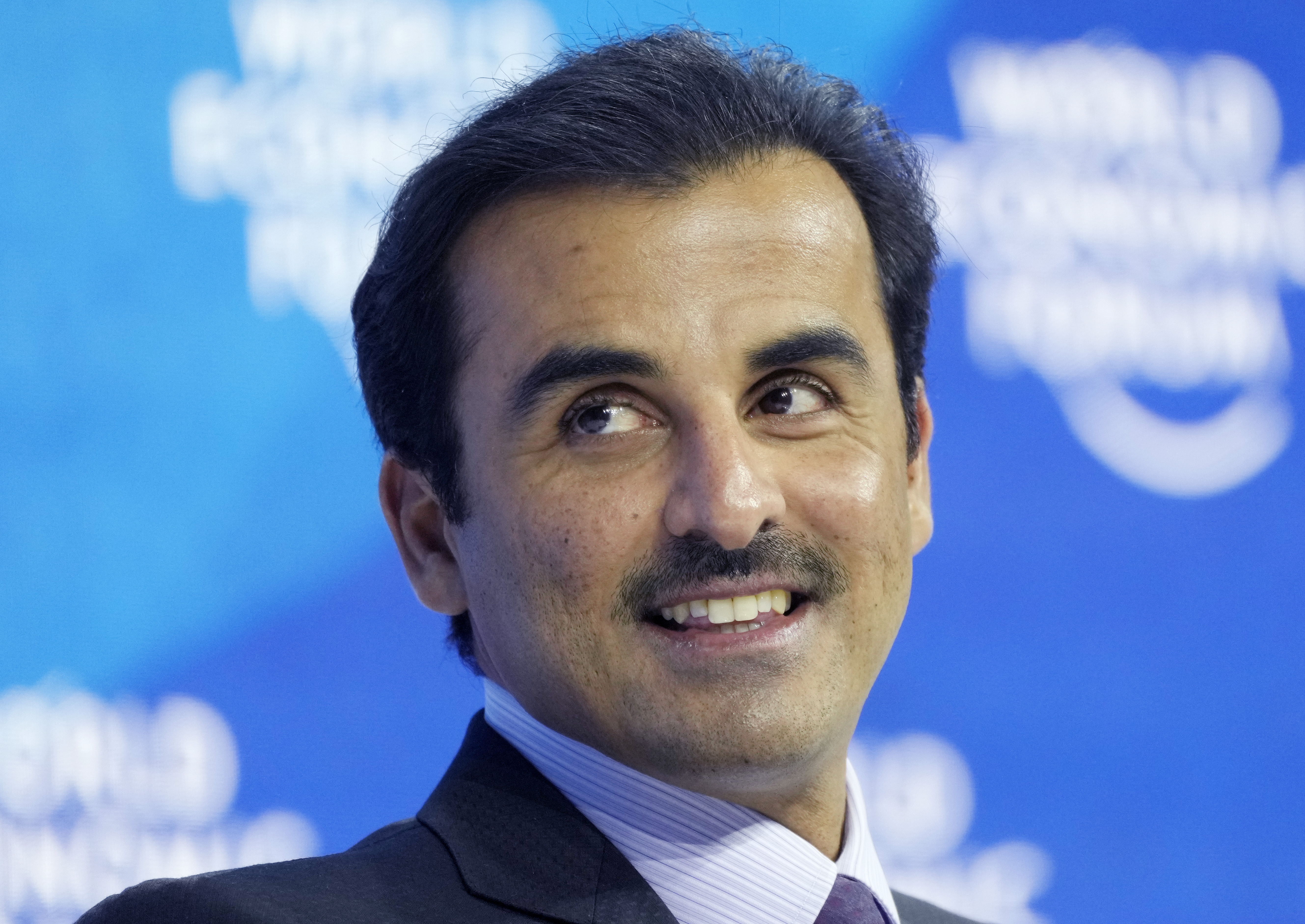 The Emir of Qatar, Sheikh Tamim bin Hamad Al Thani smiles during the World Economic Forum in Davos, Switzerland