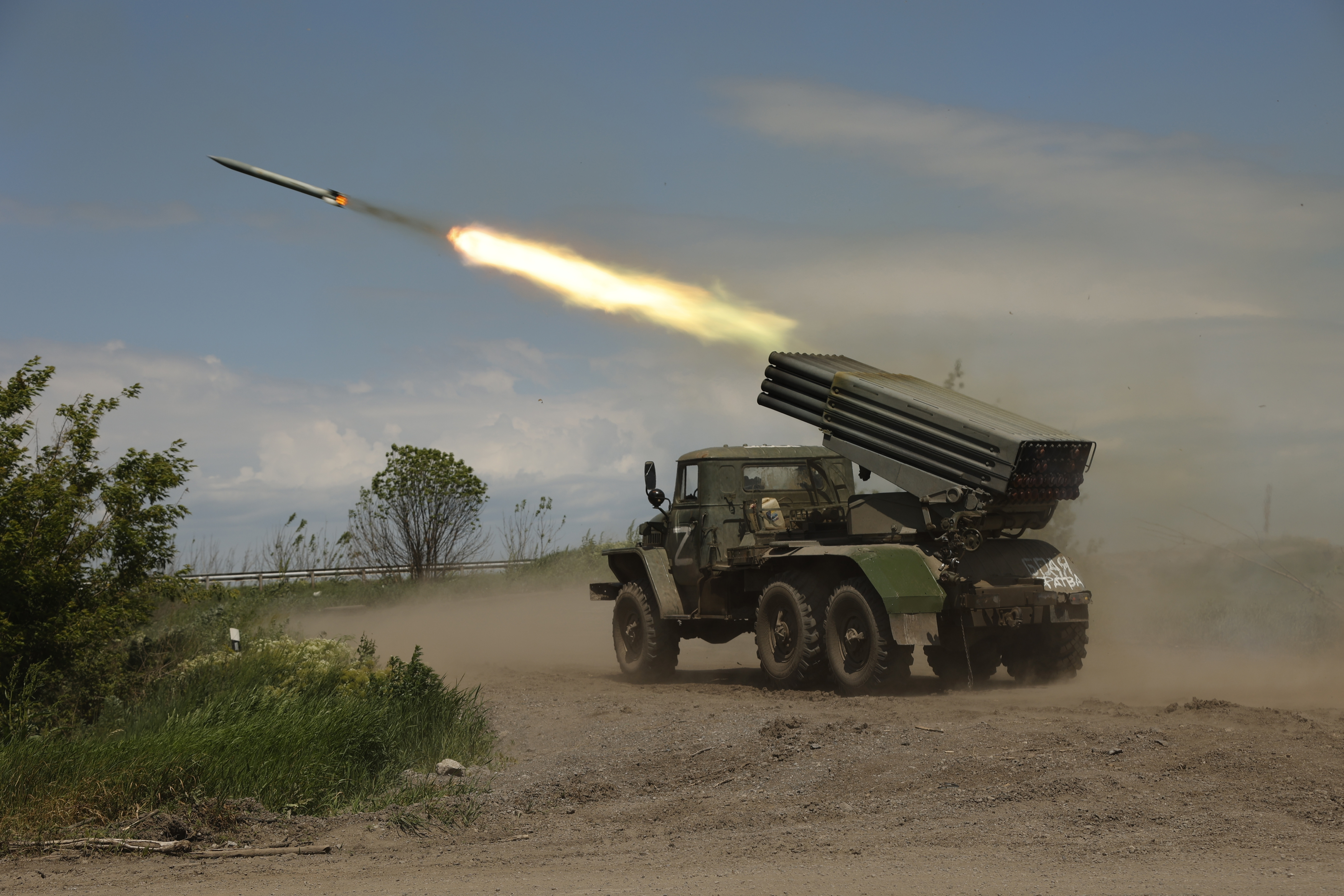 A Donetsk People's Republic militia's multiple rocket launcher fires from its position