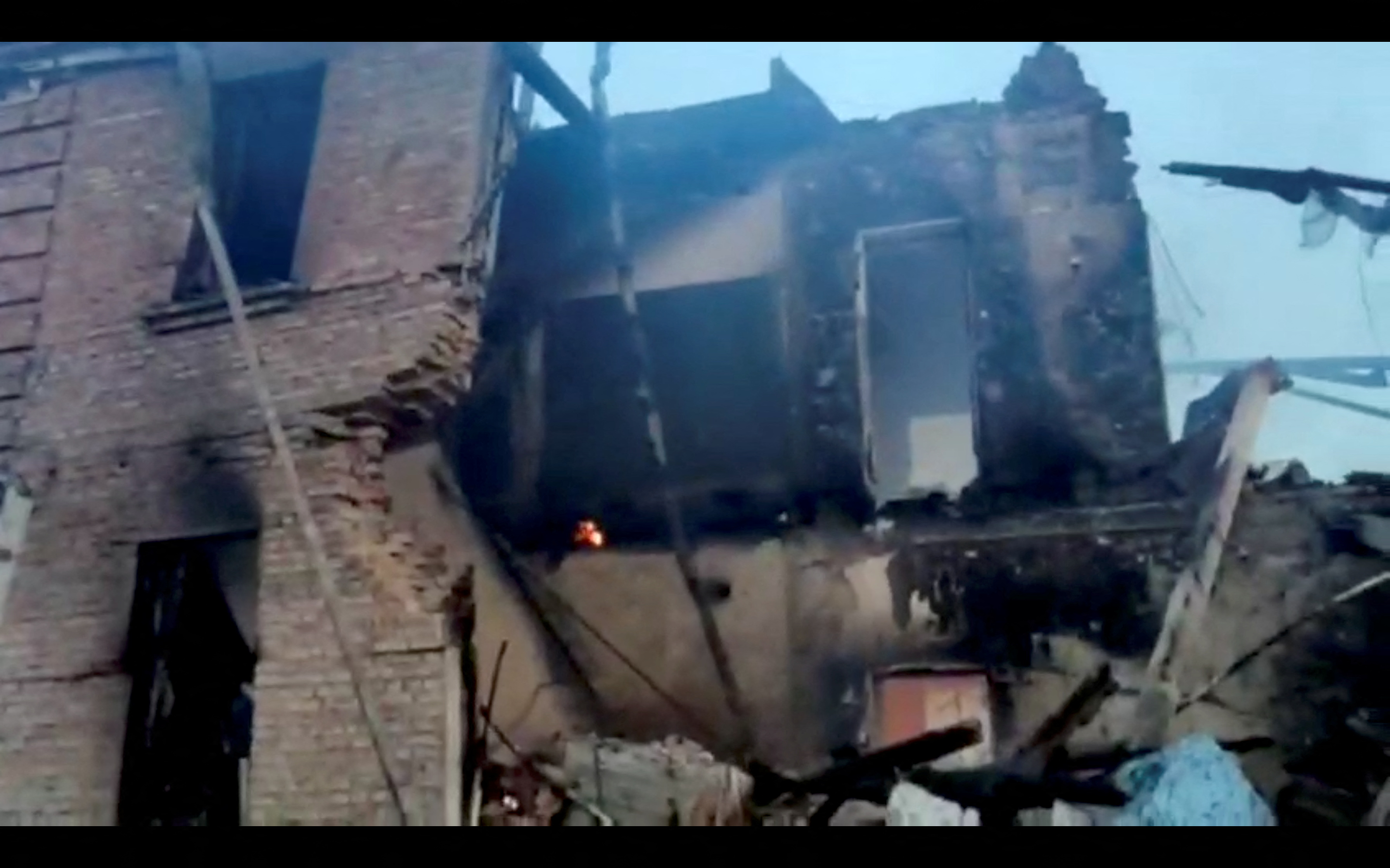 A partially collapsed school building in the village of Bilohorivka, Luhansk