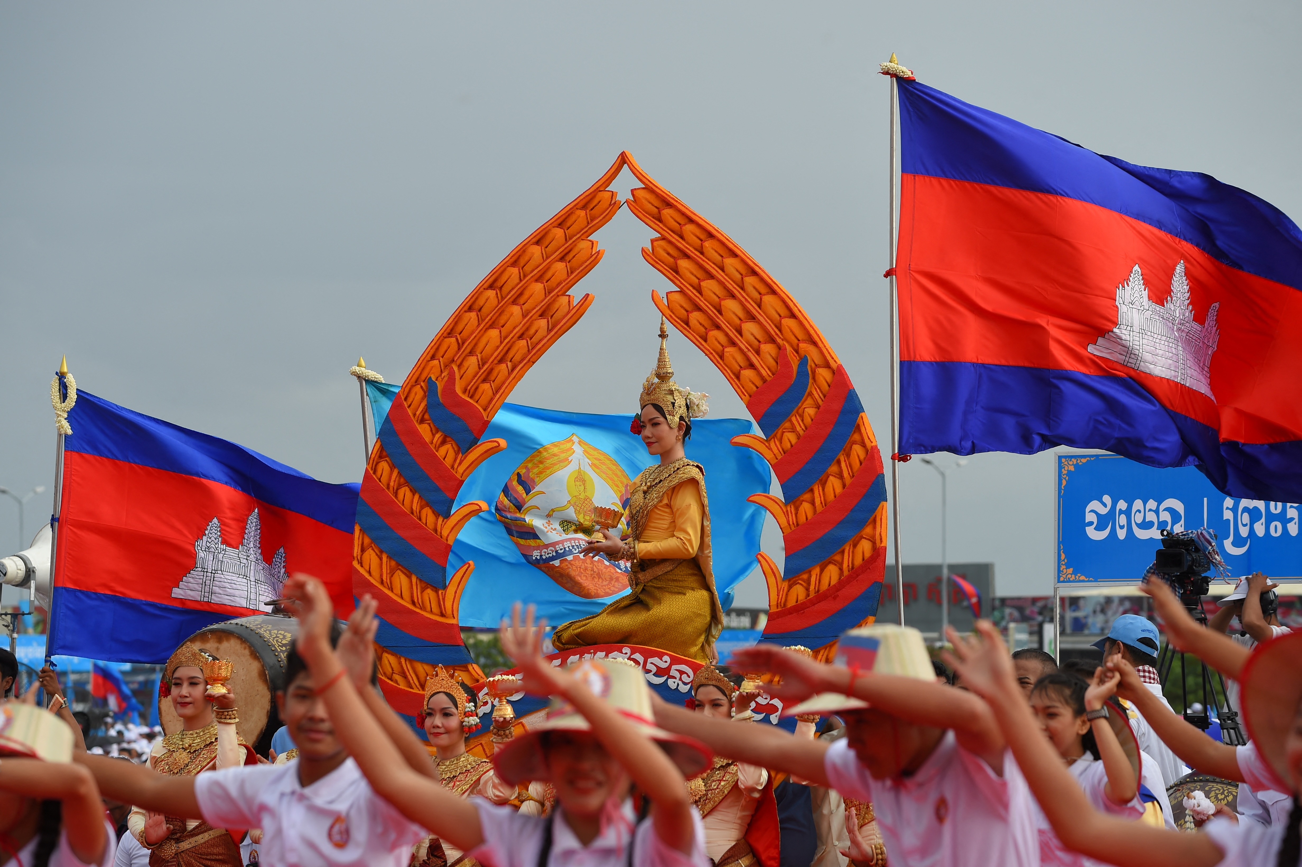 Cambodian flags and traditional dancers at a ceremony to celebrate the founding of the CPP