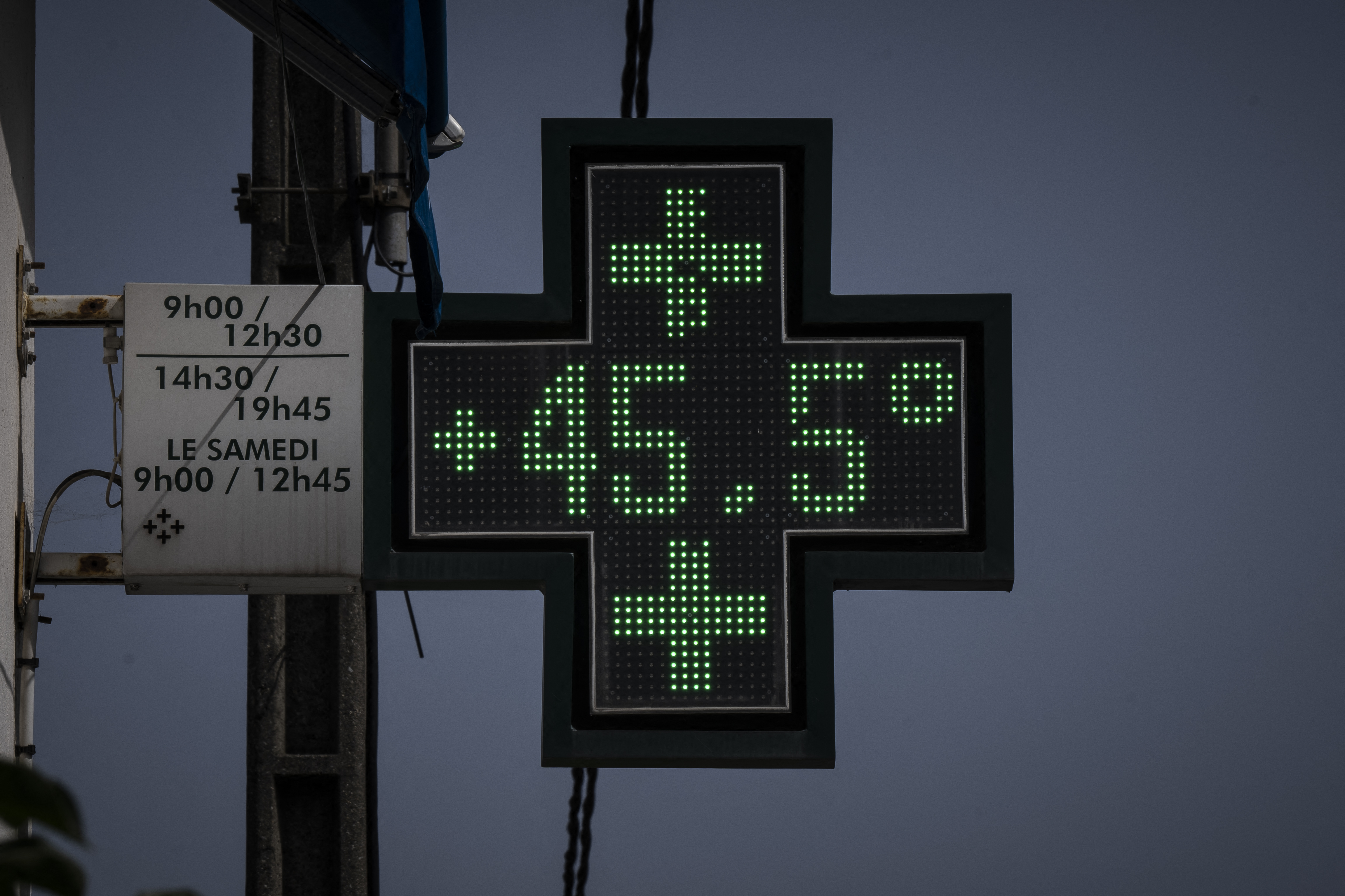 A pharmacy displays how hot it was in Toulouse in southwestern France during the earliest recorded heatwave in June 2022