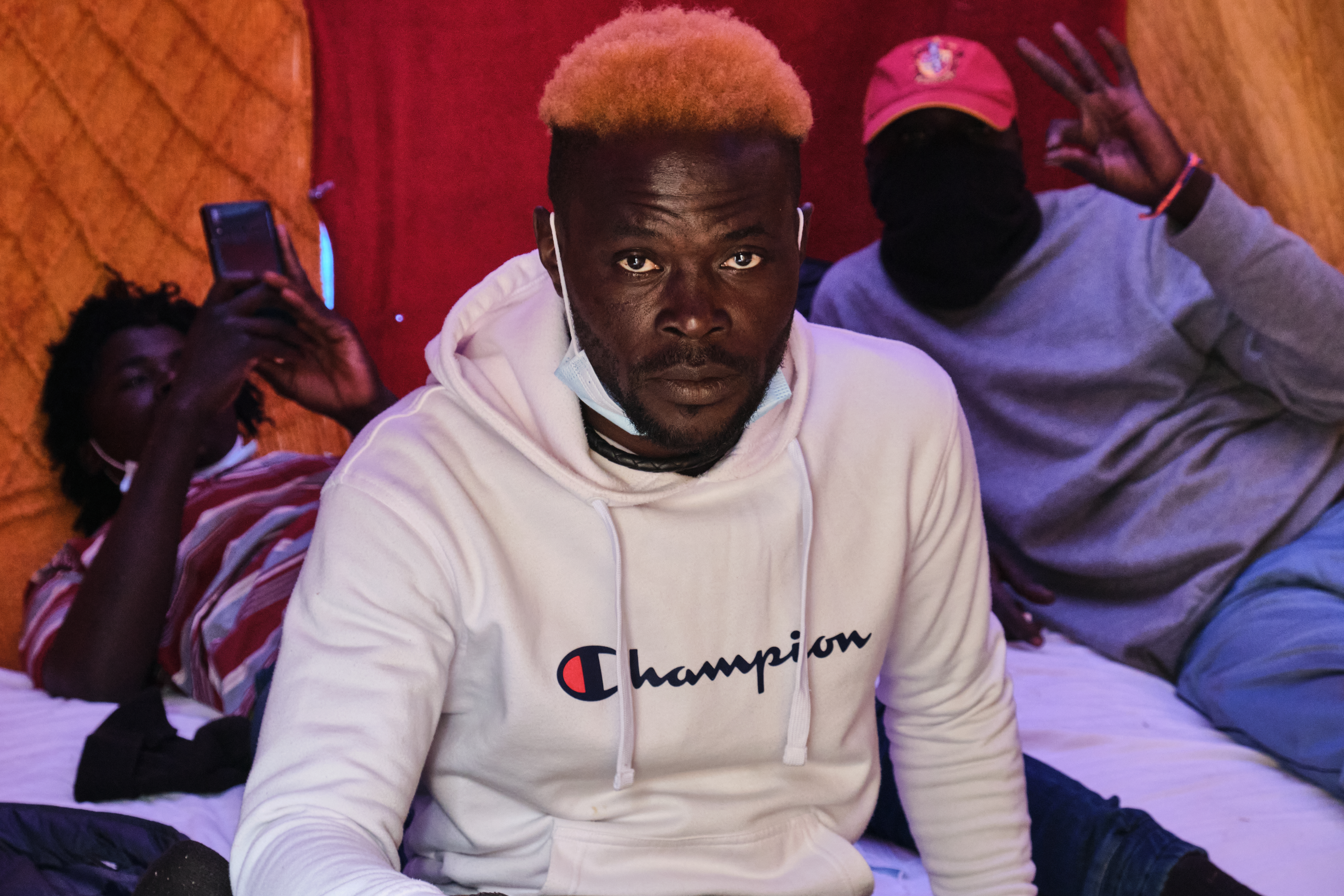 A photo of Maguette, 45, from Senegal, and two of his brothers.