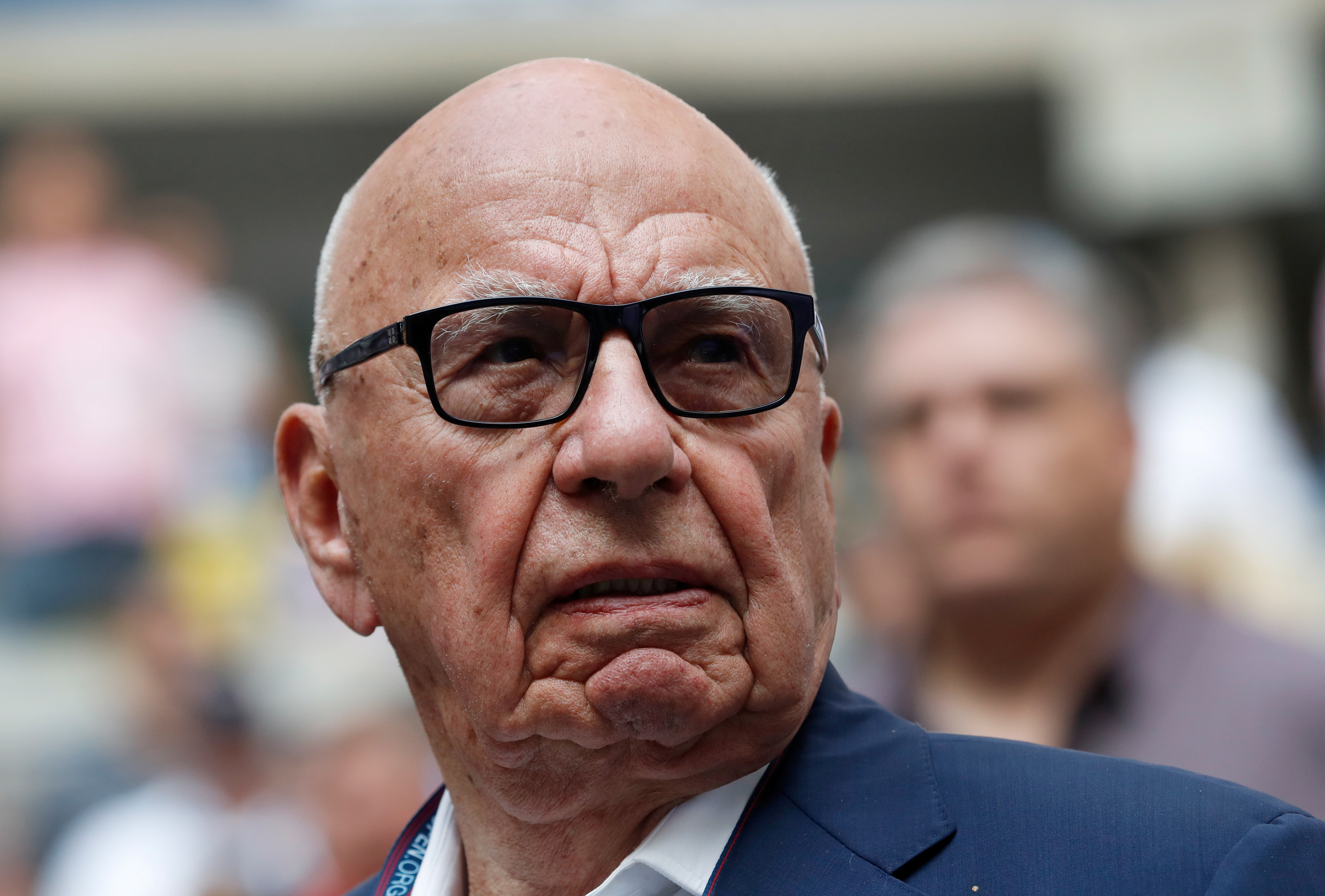 Rupert Murdoch, Chairman of Fox News Channel stands before Rafael Nadal of Spain plays against Kevin Anderson of South Africa.