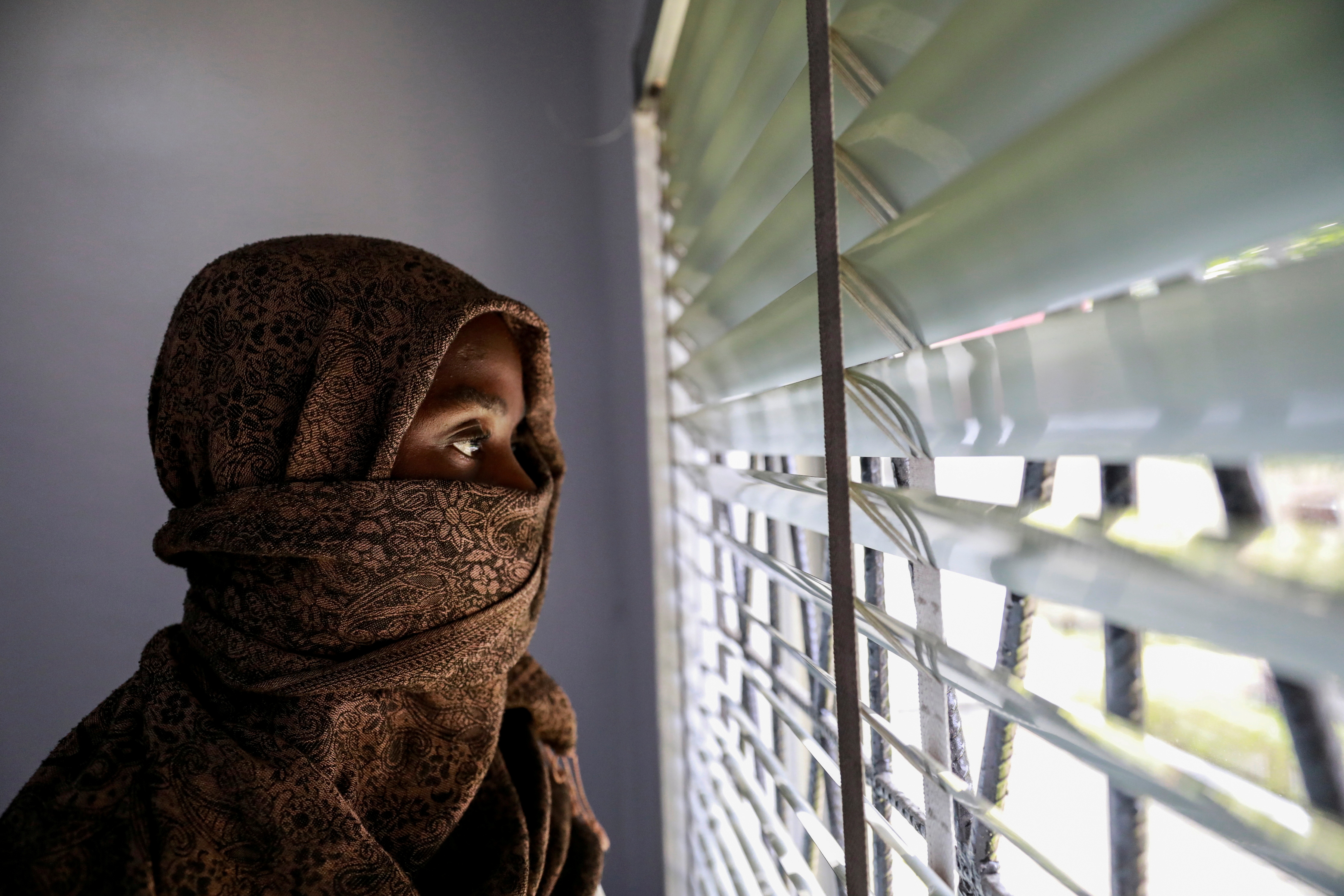A Nigerian woman who says she was raped by a family friend is seen here at a centre for sexual violence survivors in Lagos, Nigeria, in 2021.