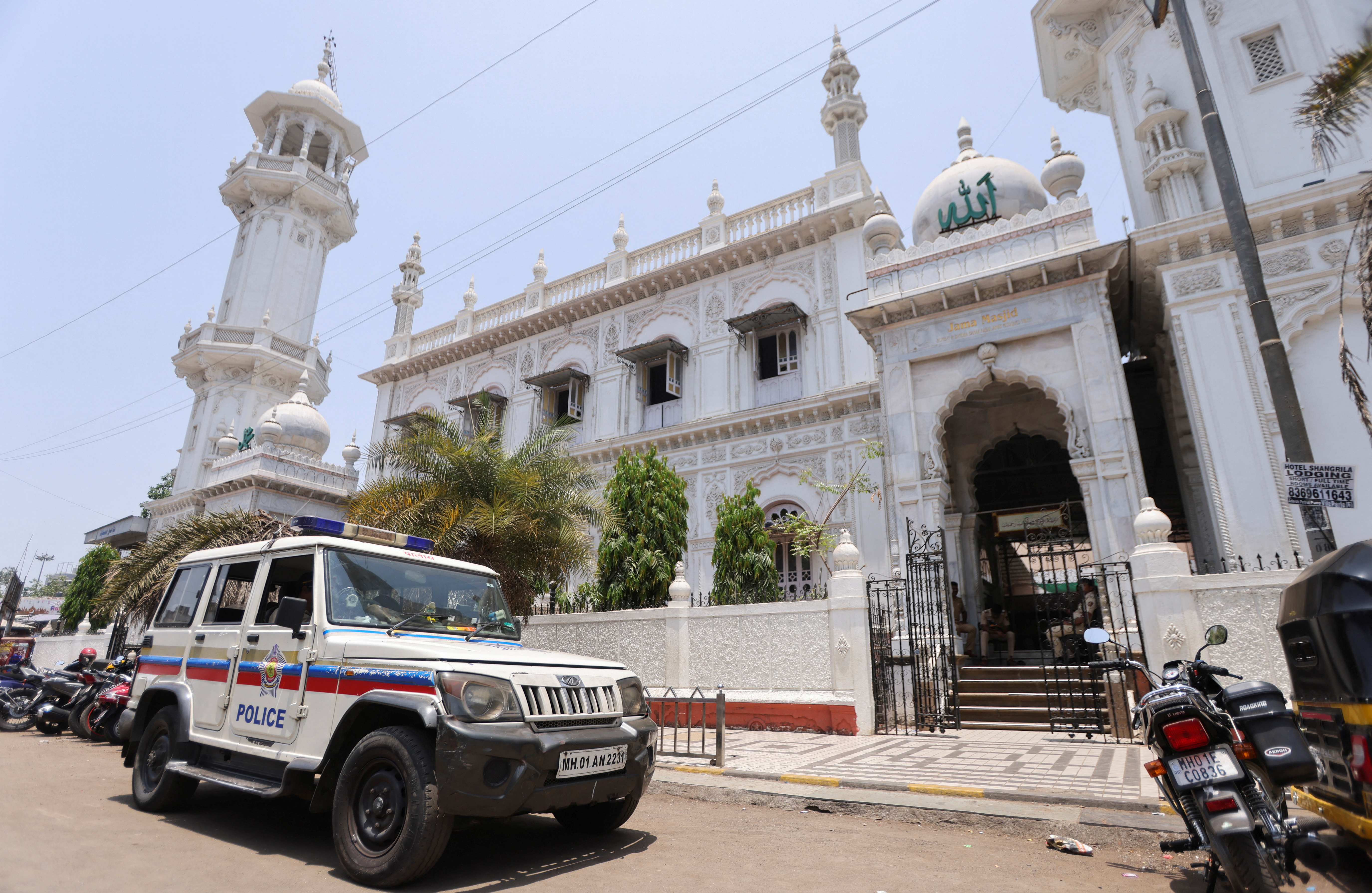 Police van parked outside a mosque