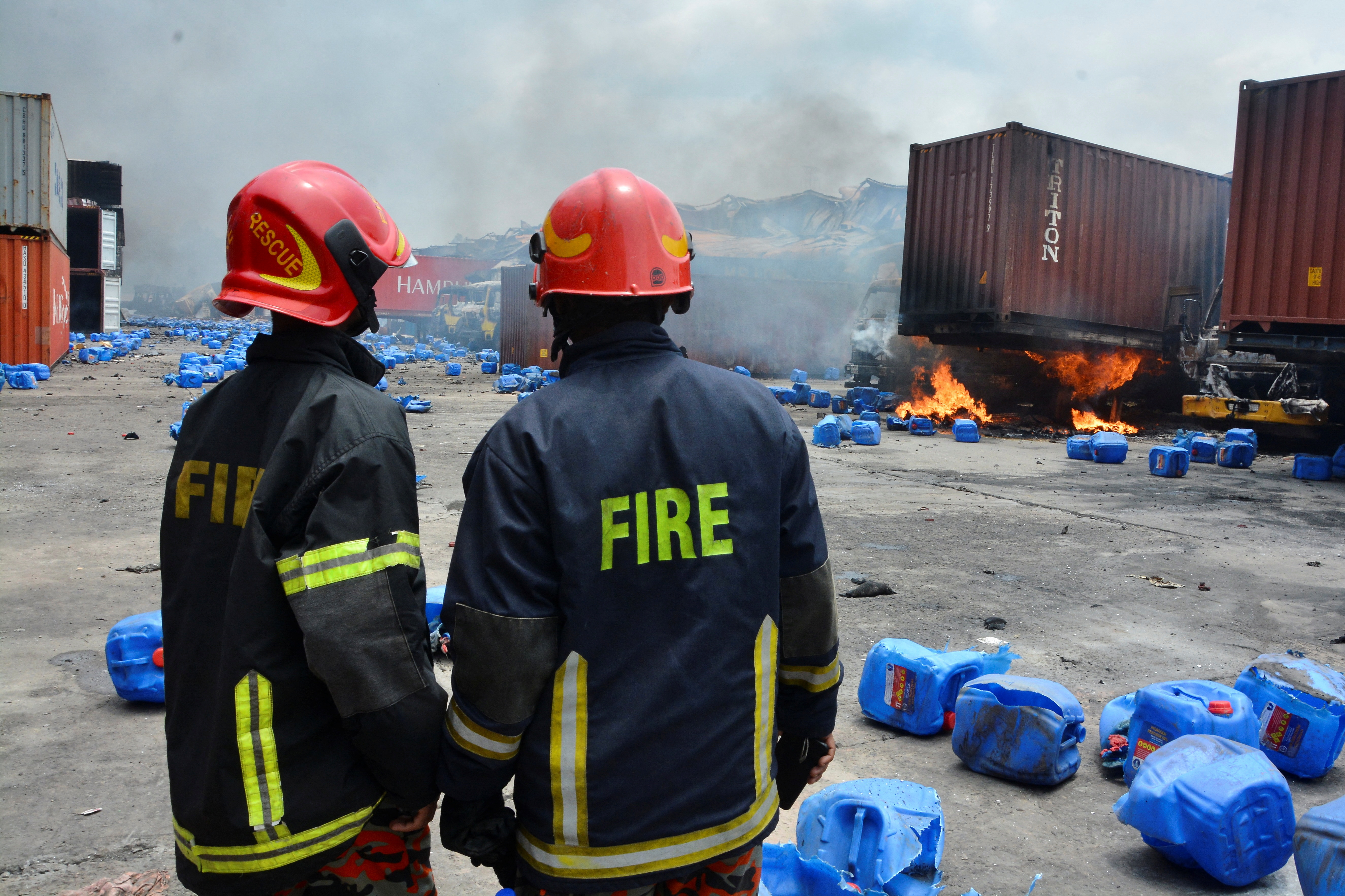 Firefighters work on the spot after a massive fire broke out