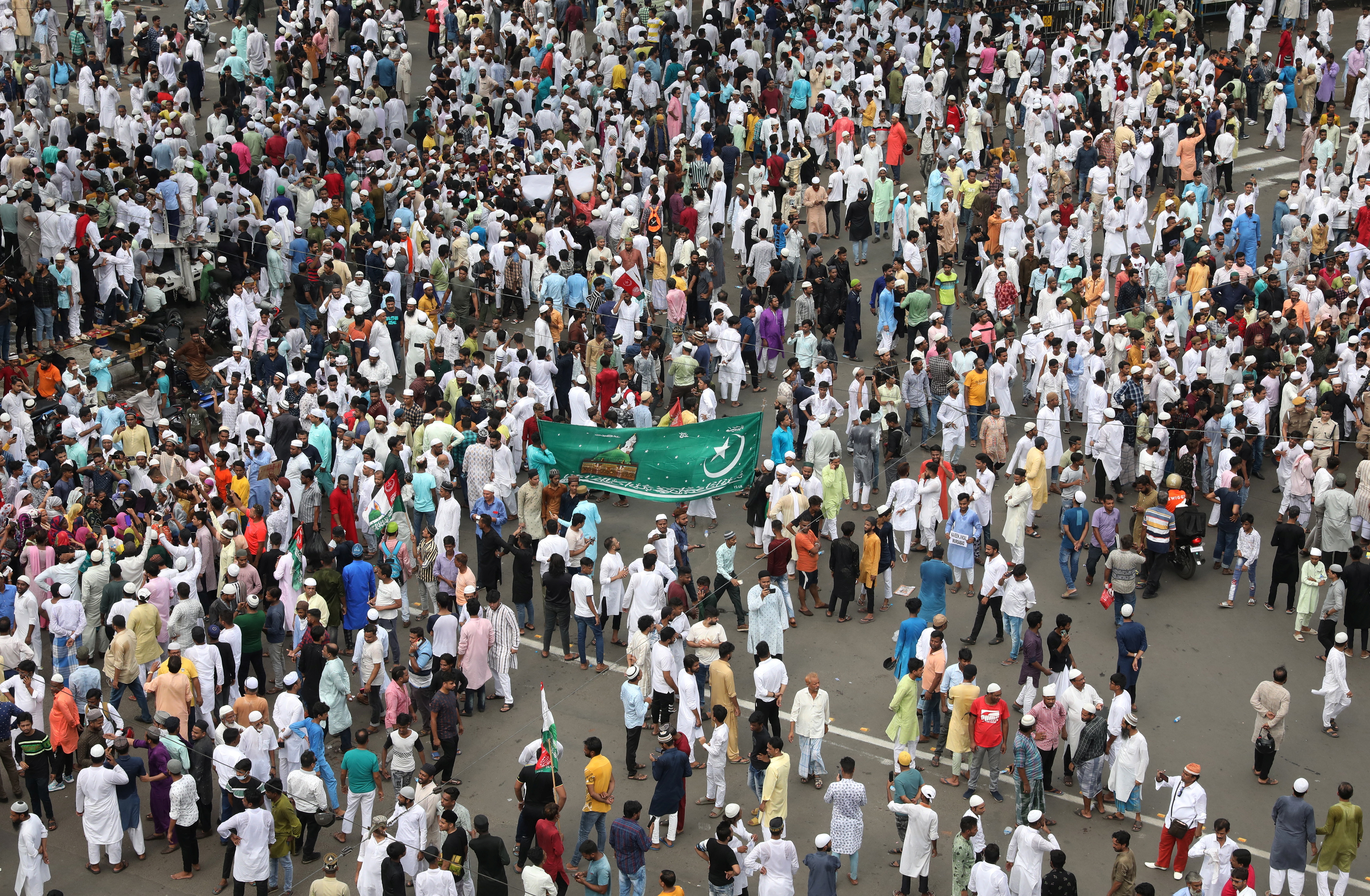 Muslims participate in a protest demanding the arrest of Bharatiya Janata Party (BJP) member Nupur Sharma for her comments on Prophet Mohammed, in Kolkata, India