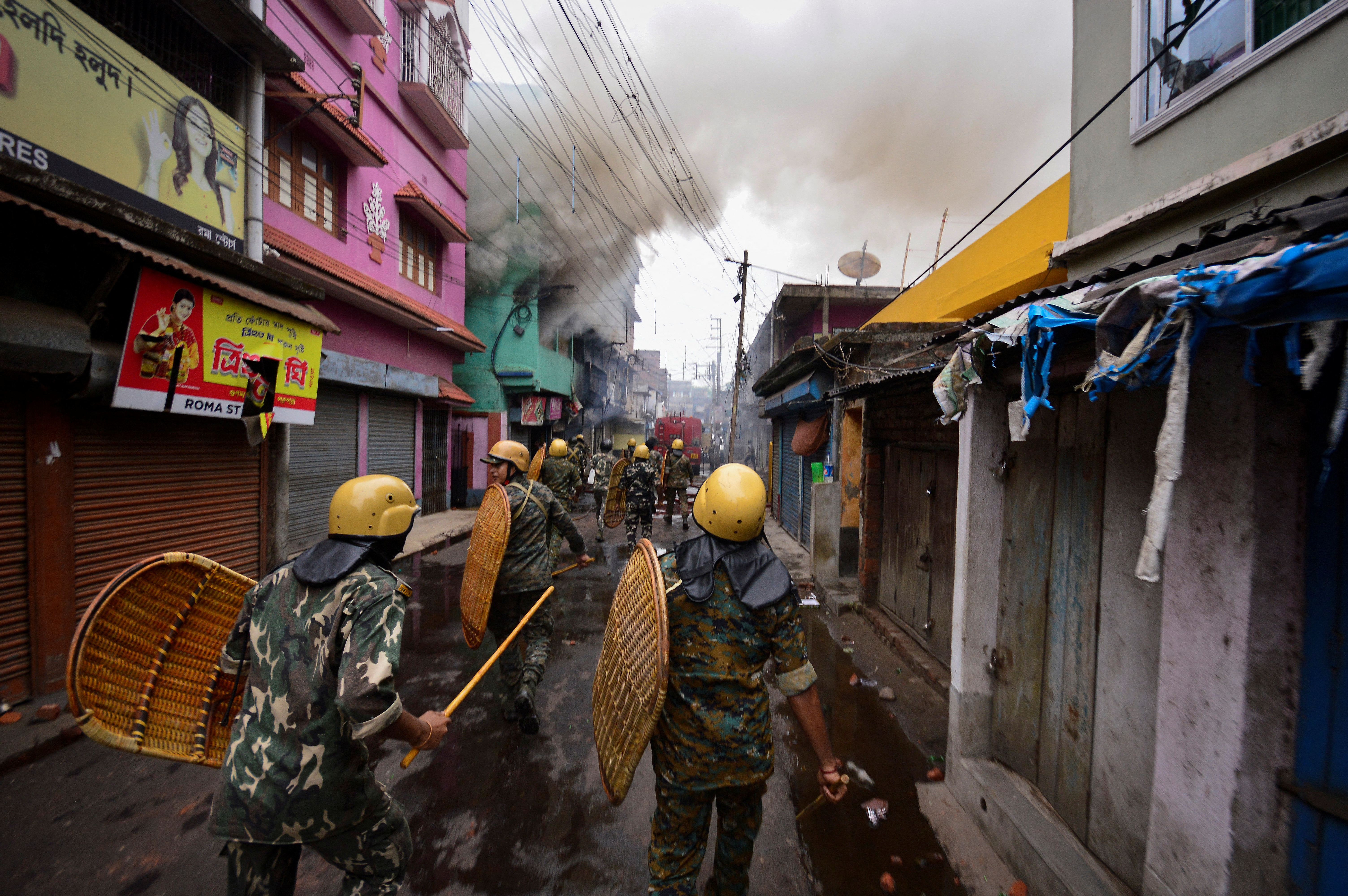 Security personnel patrol on a street after violence erupted between police and protestors over a comment on Prophet Mohammed by BJP member Nupur Sharma, in Howrah on the outskirts of Kolkata