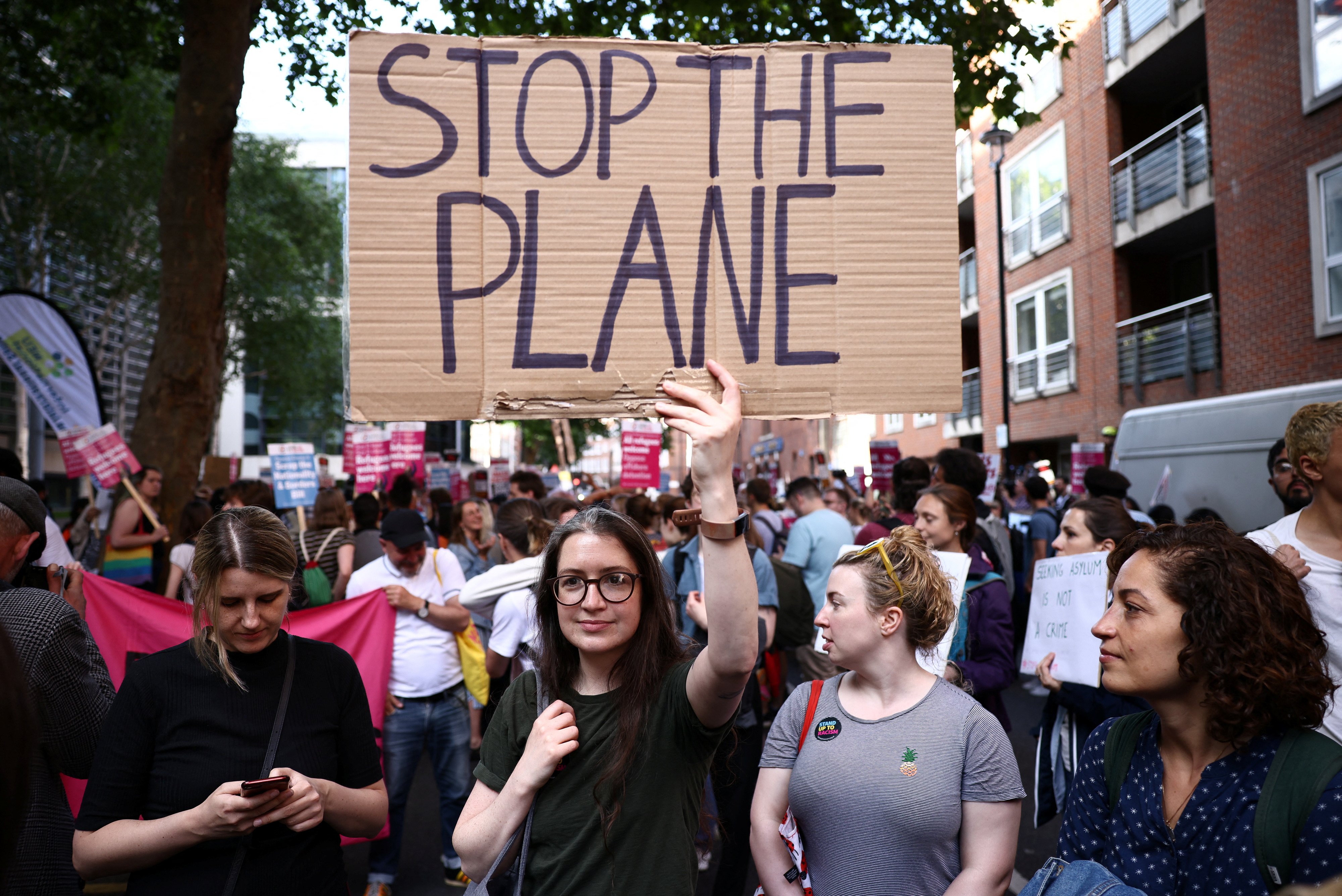 Protestors demonstrate outside the Home Office in London, the UK.