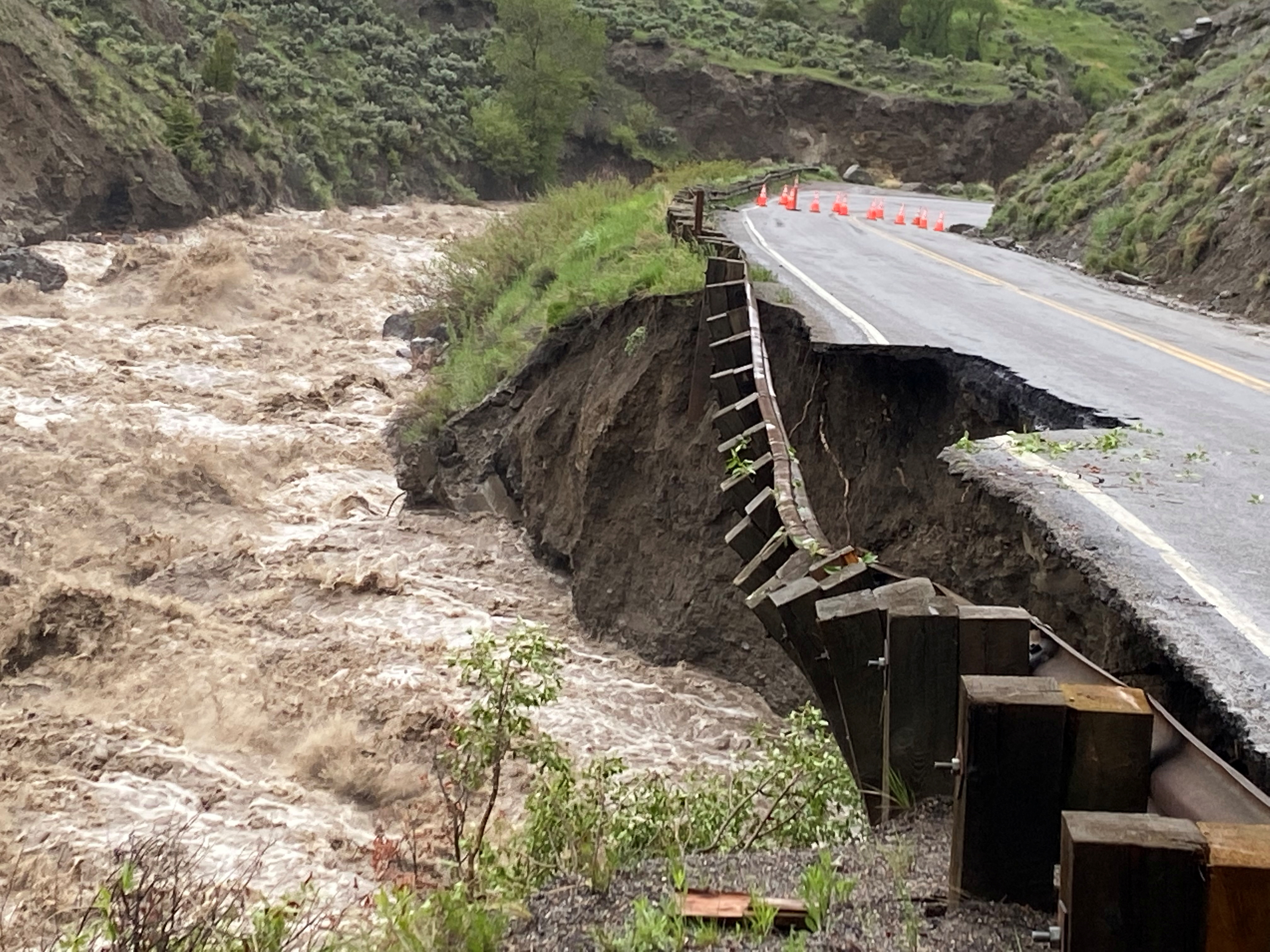 Raging river waters on the left of Yellowstone's North Entrance road destroy part of the road.
