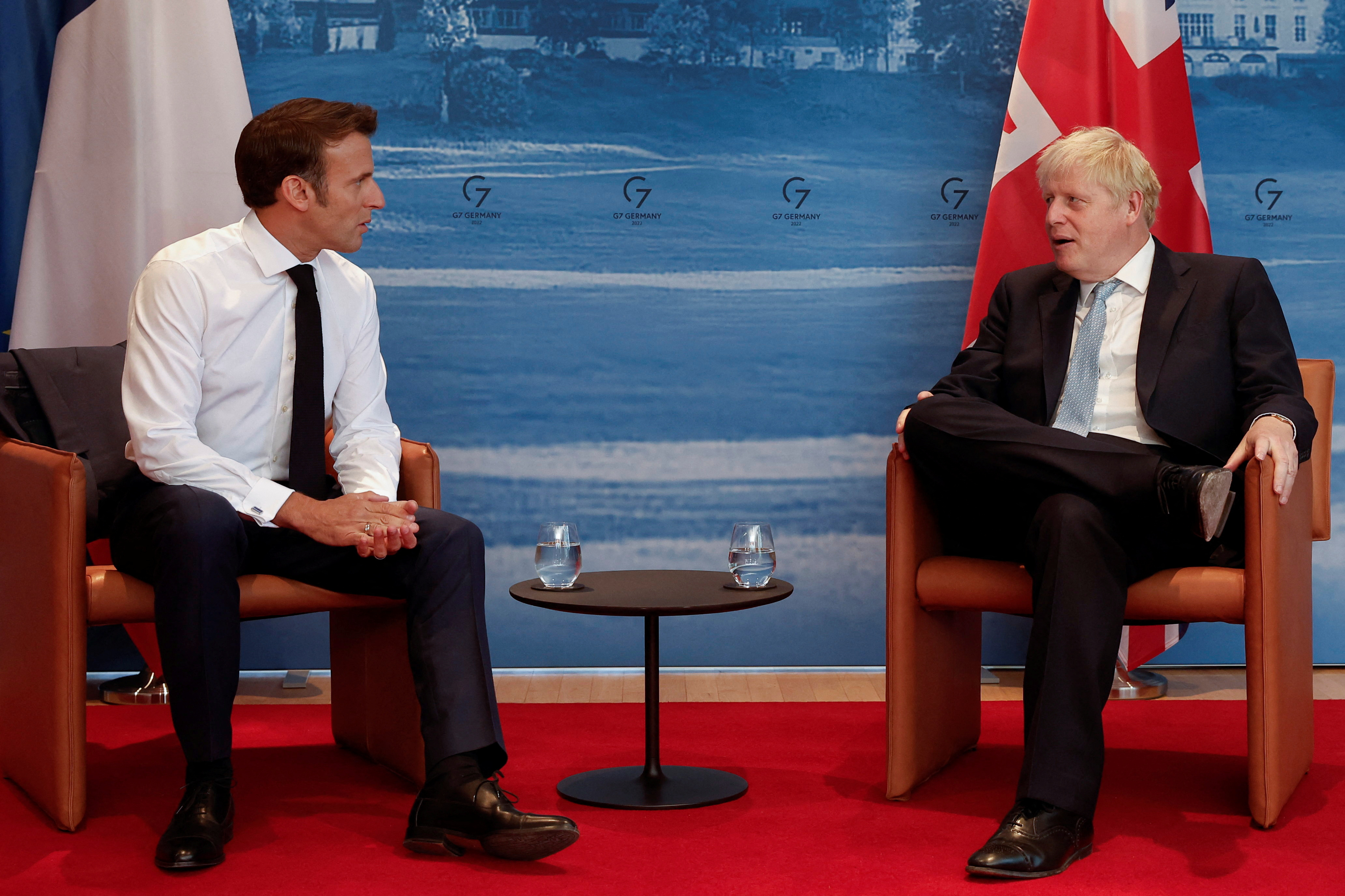 French President Emmanuel Macron and British Prime Minister Boris Johnson hold a bilateral meeting during a G7 leaders summit at Bavaria's Schloss Elmau castle, near Garmisch-Partenkirchen, Germany June 26, 2022. 