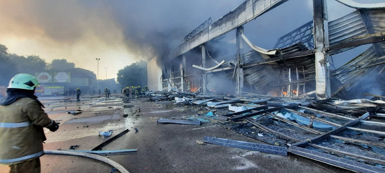 Rescuers work at a site of a shopping mall hit by a Russian missile in Kremenchuk, Ukraine.