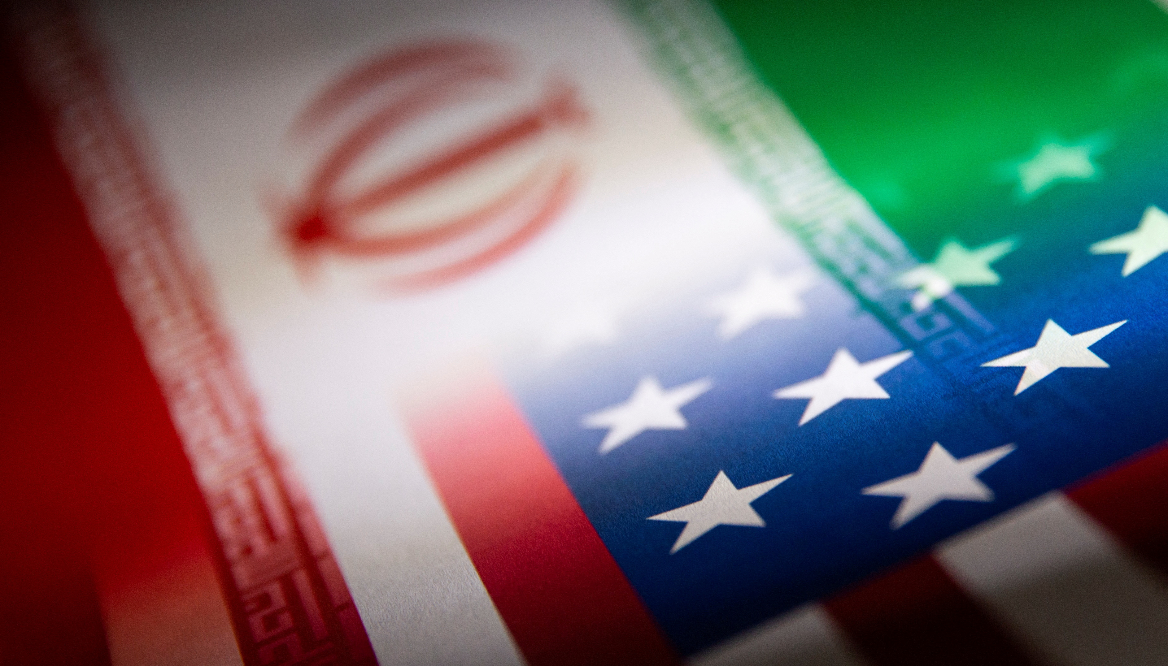 Iran and US flags printed on paper in this illustration from January 2022. [Dado Ruvic/Illustration/Reuter