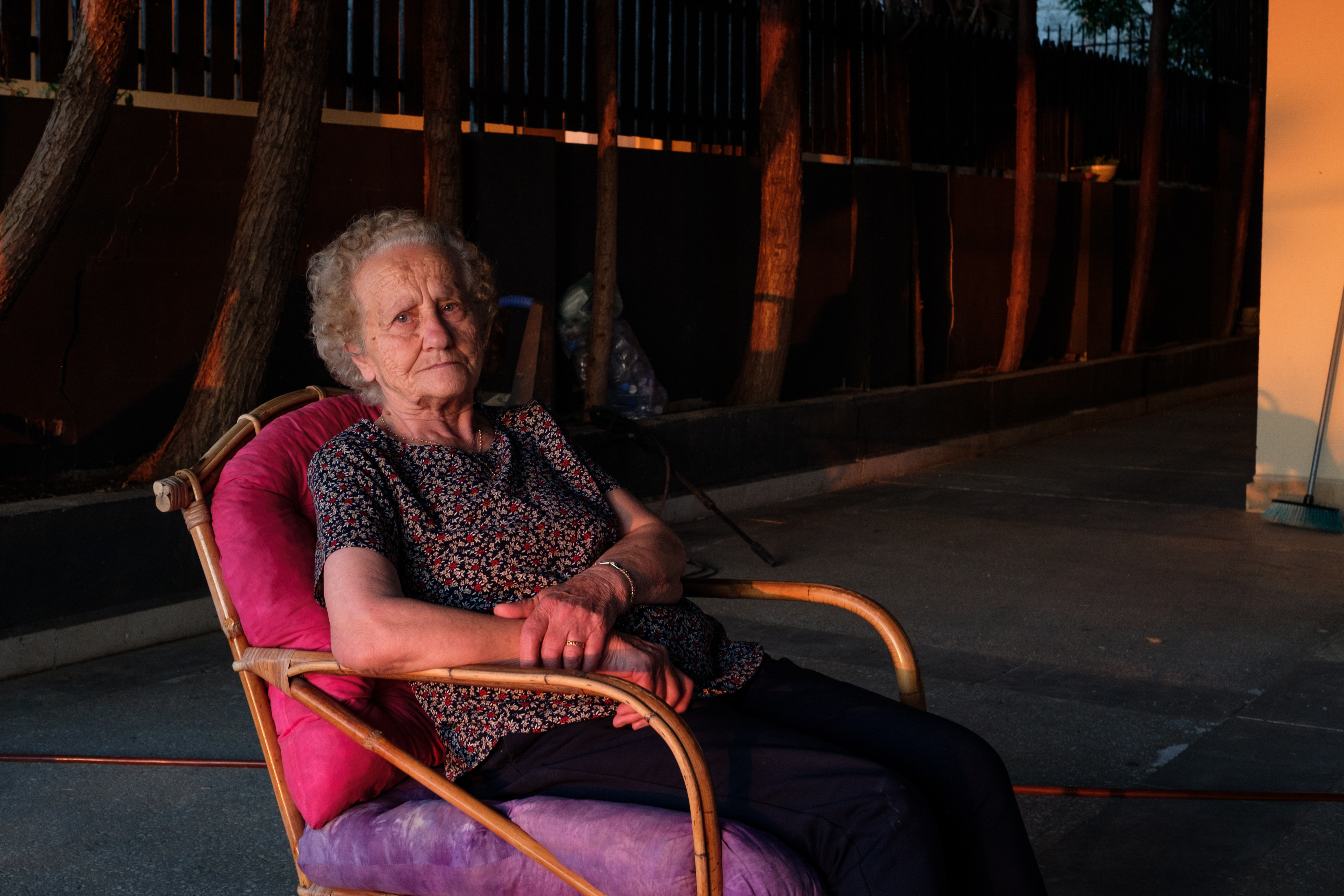 Amaline sitting on her verandah in the shade