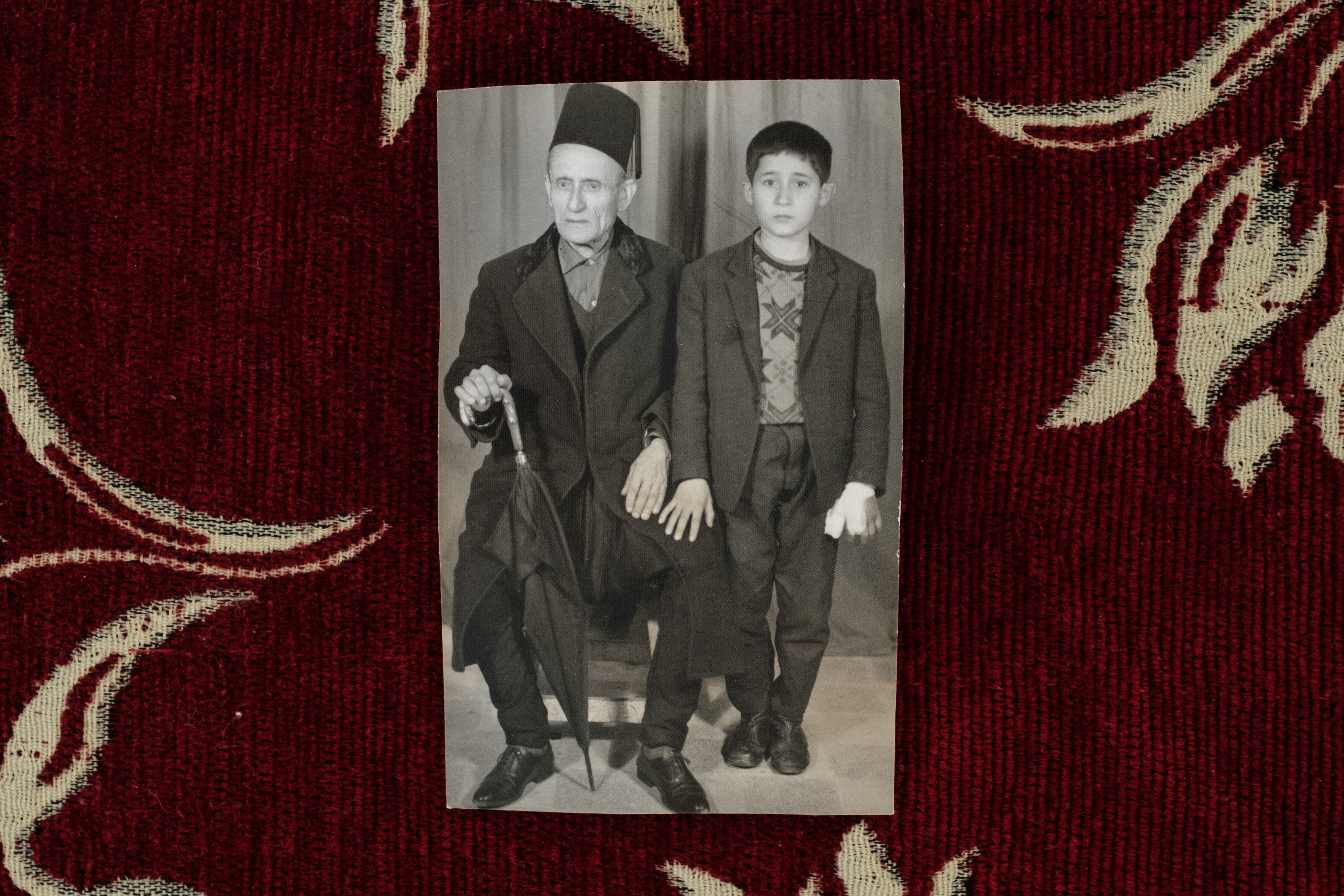 A black-and-white photo of Moussa Elias with his grandson