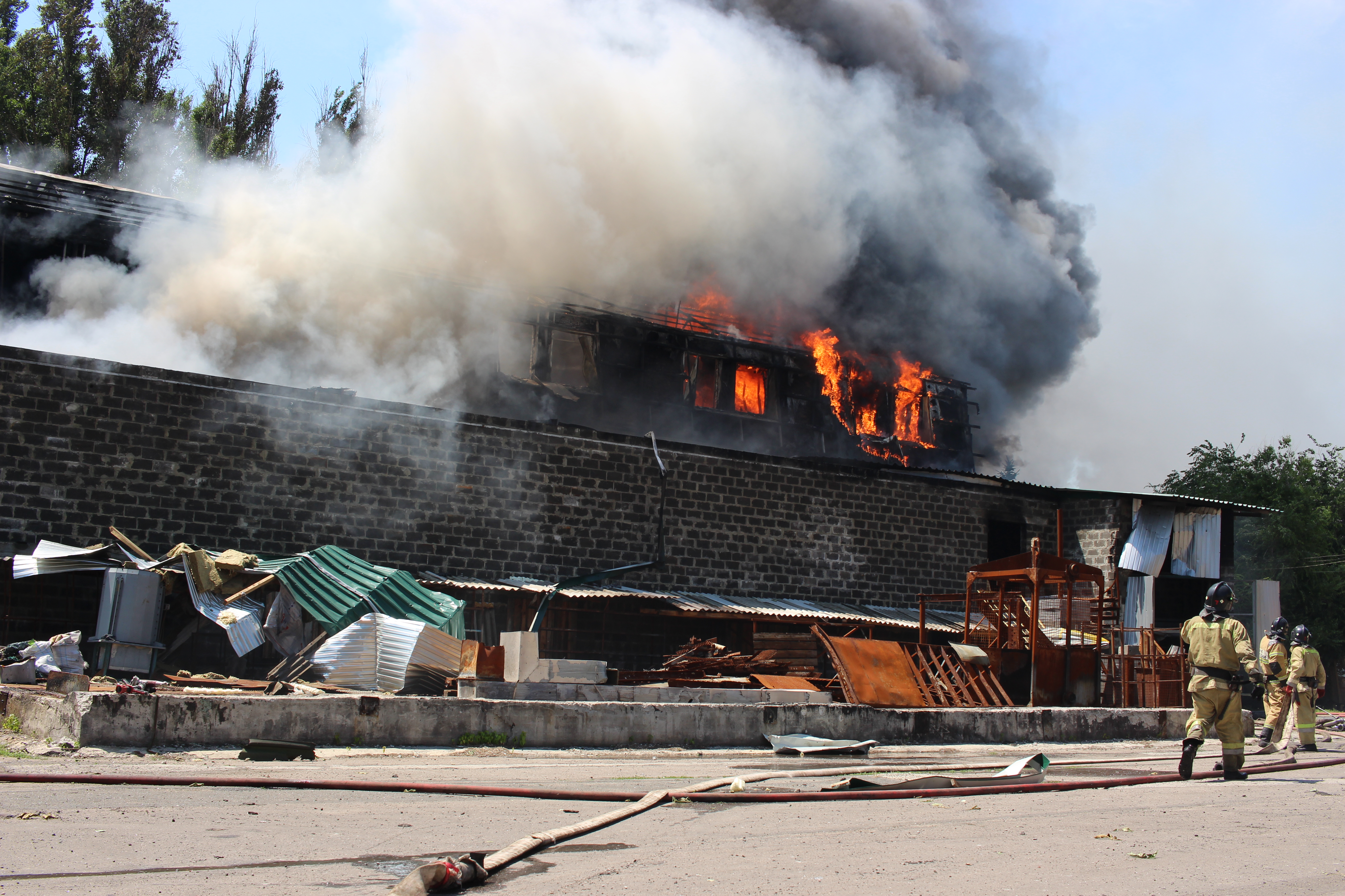 DONETSK, UKRAINE - JUNE 13: Firefighters of the Ministry of Emergency Situations of the DPR are seen trying to contain the fire near the gas station at Kievsky district as Russia - Ukraine war continues in Donetsk, Ukraine on June 13, 2022. Three people, including a child, were killed and at least ten injured as a result of the fires at the water supply base and several other places that were set on fire. ( Leon Klein - Anadolu Agency )