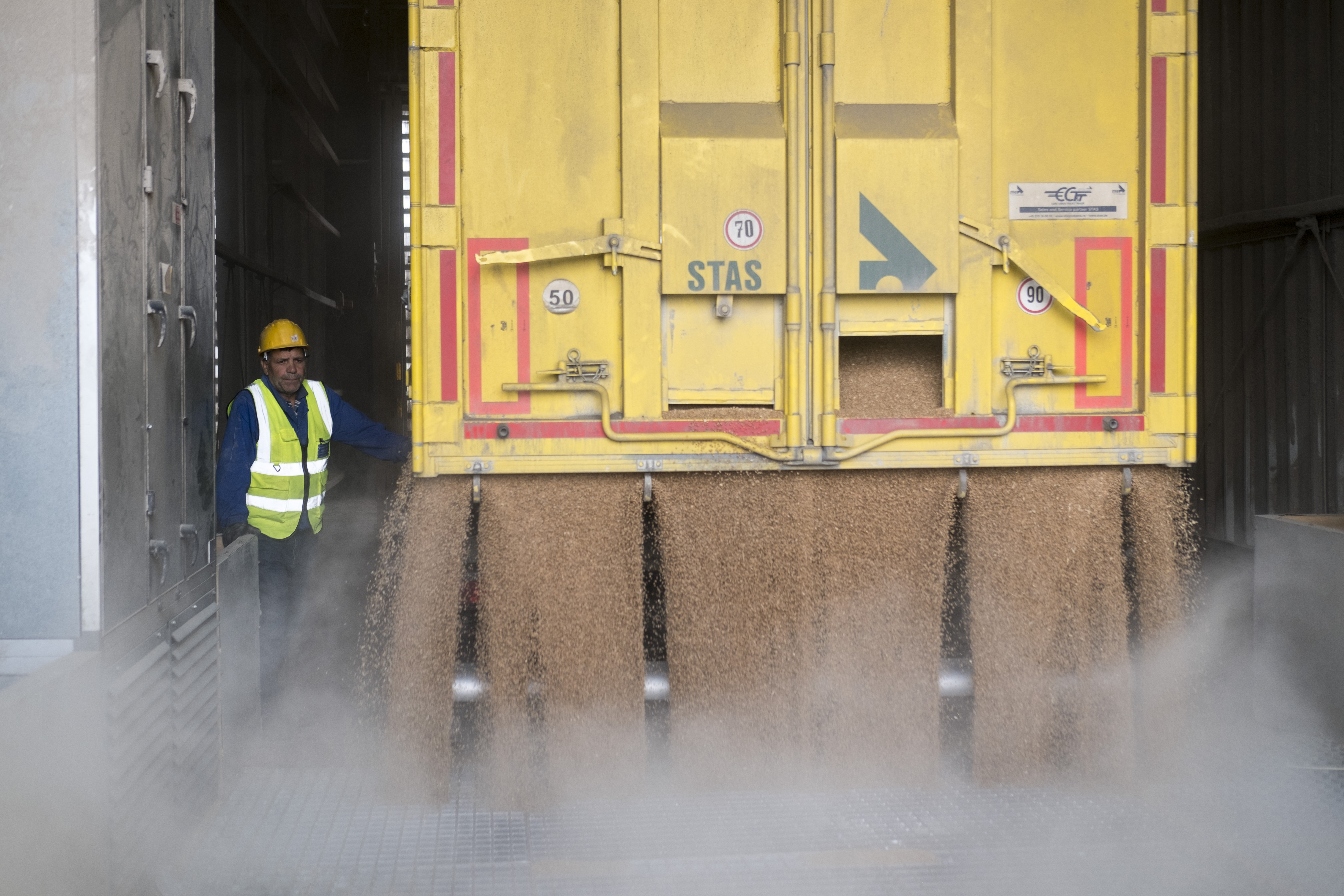 A cereal truck is unloaded at one of the port's operators. The cereals also reach Constanta port by truck, but this method is far less effective than by barge, approximately 60 trucks being the equivalent in capacity of 1 barge. The Romanian government took measures to increase the customs processing speed at the road borders of Romania with Ukraine and Moldova, in order to facilitate the transit of cereal trucks that have been forming queues with several days waiting times at the borders crossings.
