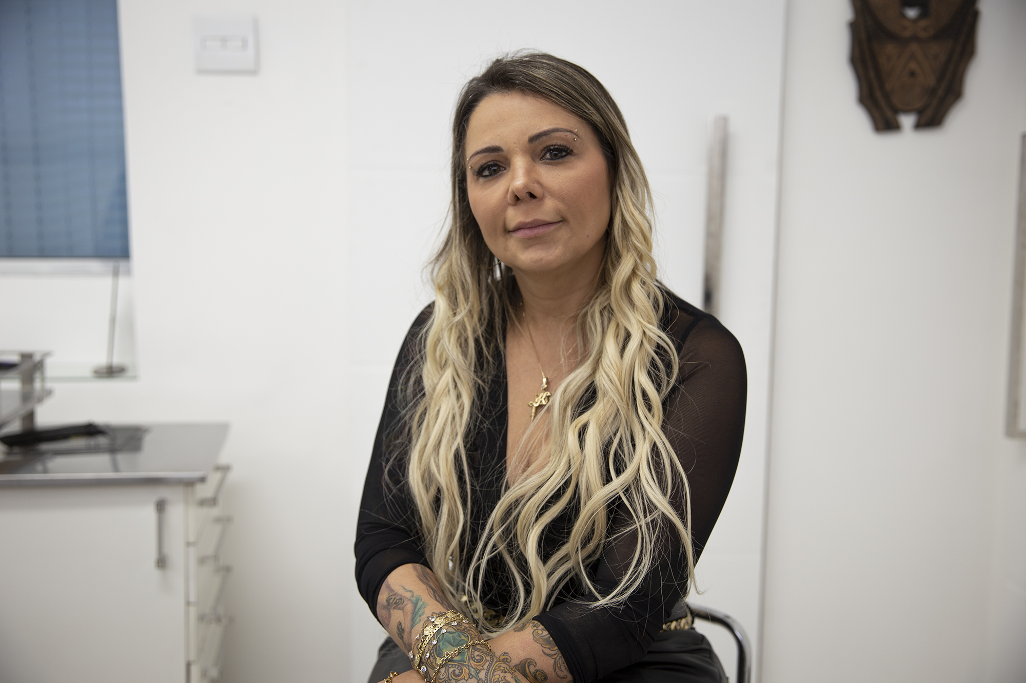 Brazilian tattoo artist Karlla Mendes poses for a photo