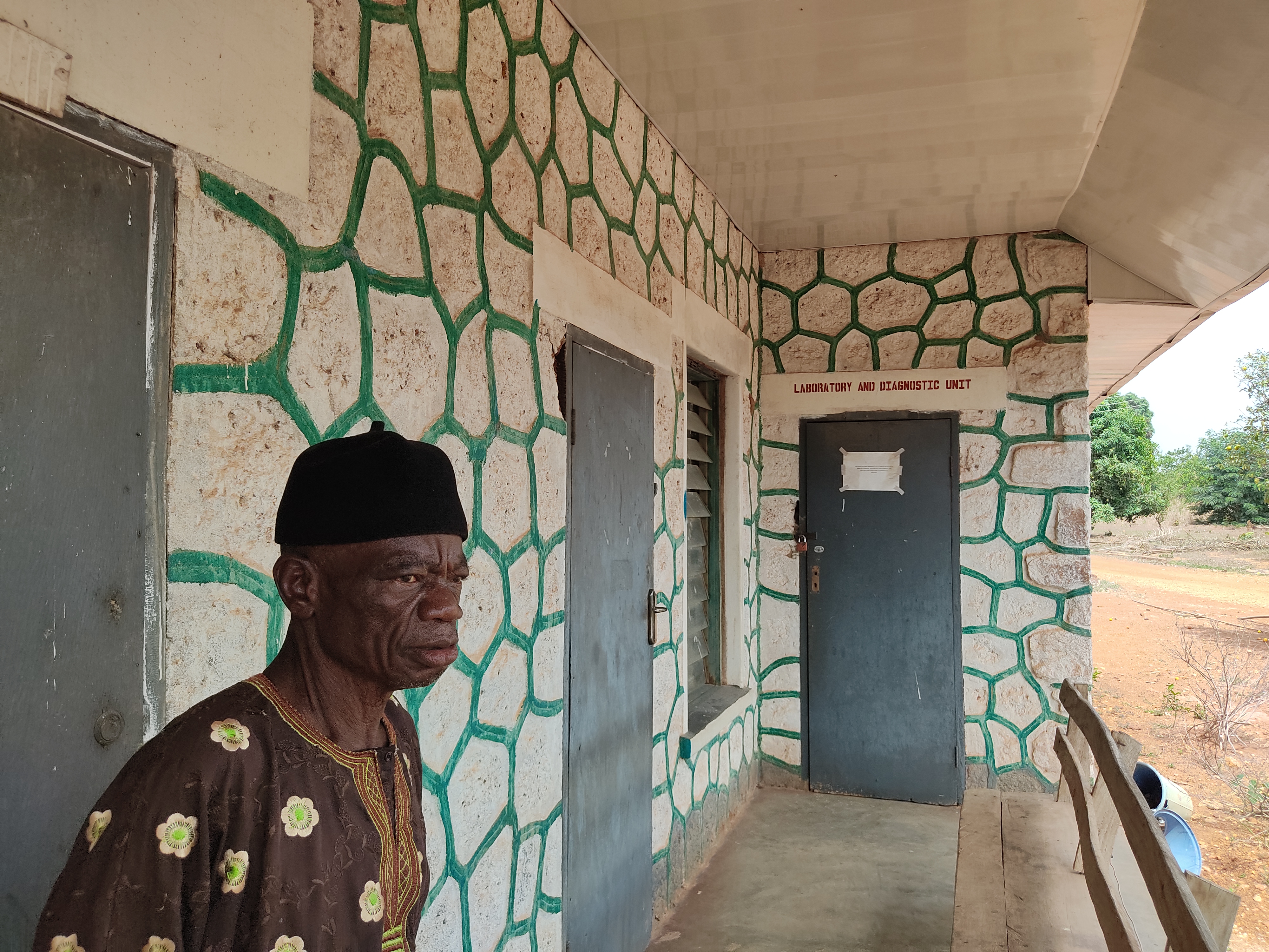 A man sits outside the hospital at a laprosarium in Omu Aran, Kwara state, Nigeria