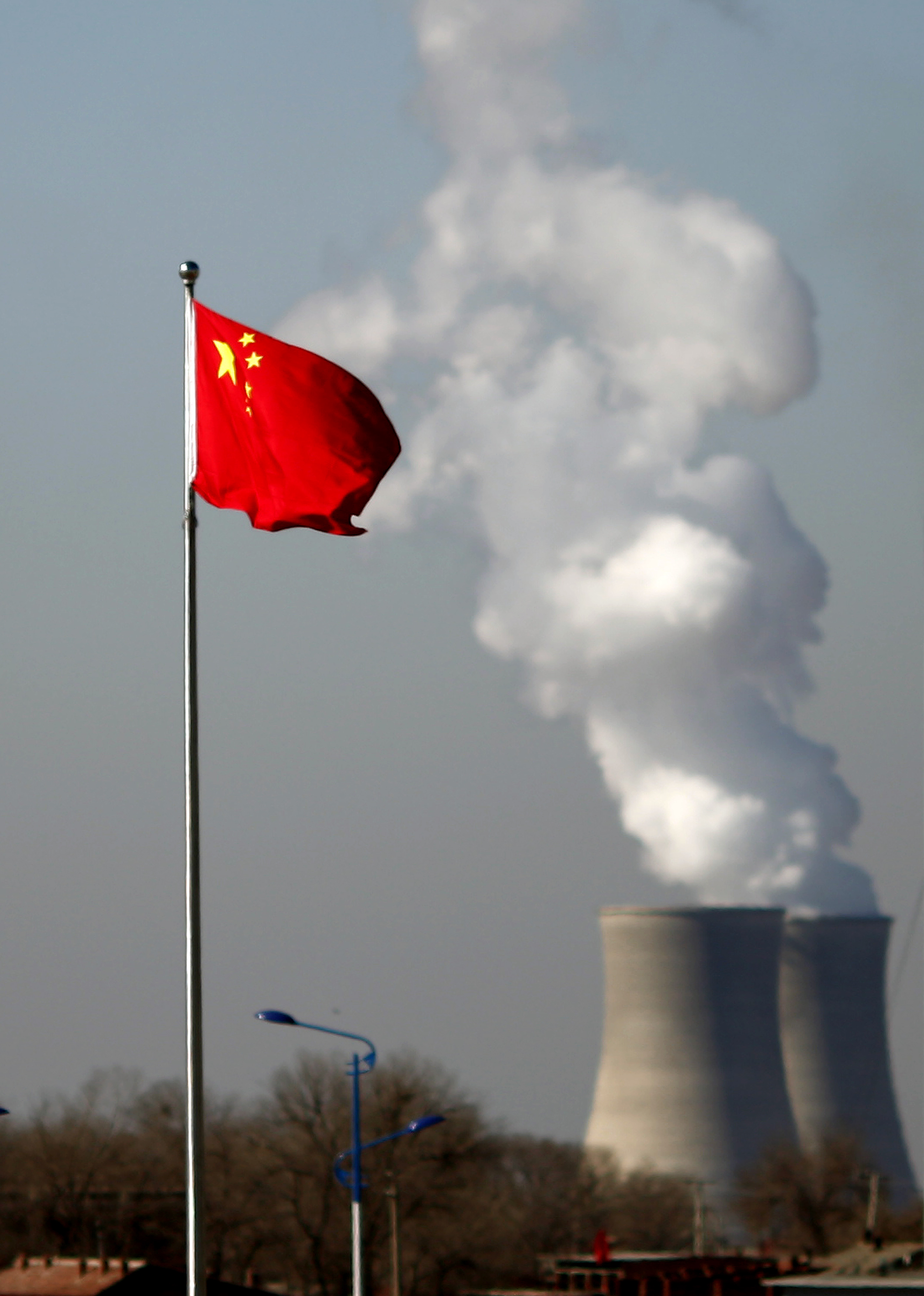 China nuclear plant with a Chinese flag flying in the foreground.