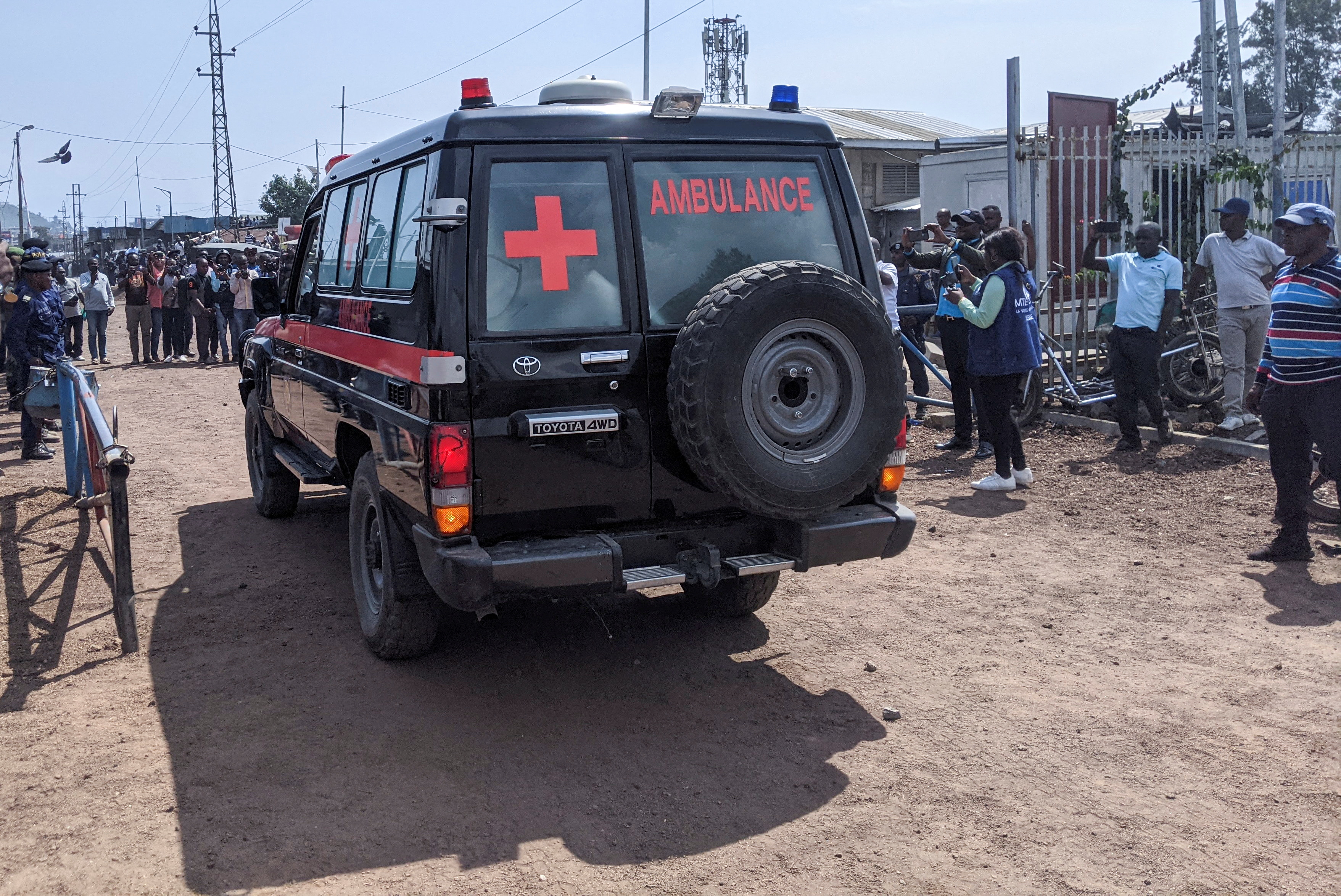A Congolese military ambulance drives into Rwanda to transport the body of a Congolese soldier