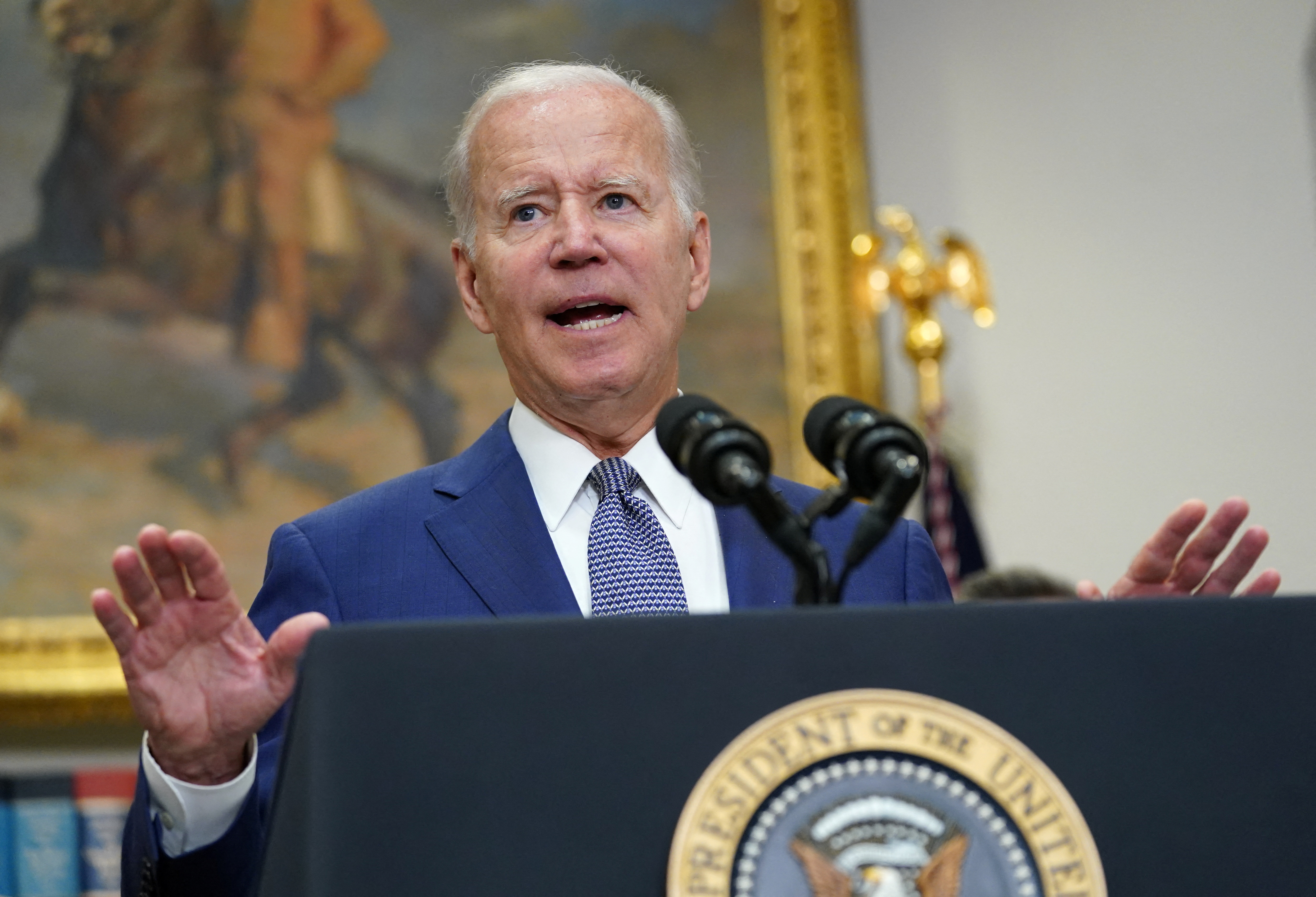 Joe Biden speaks at a podium at the White House