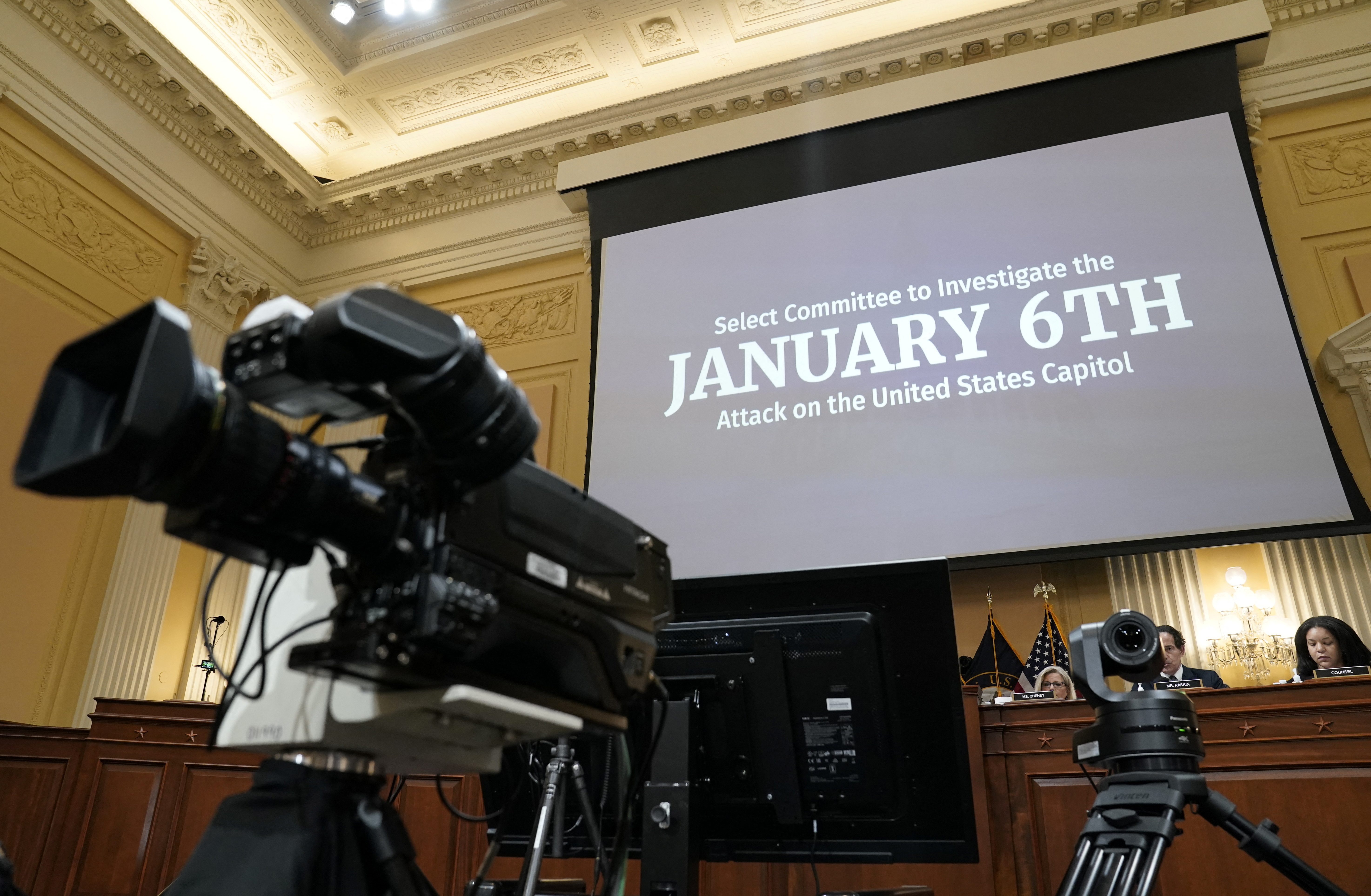 A general view of the January 6 hearing on July 12 showing cameras with committee members in the background.