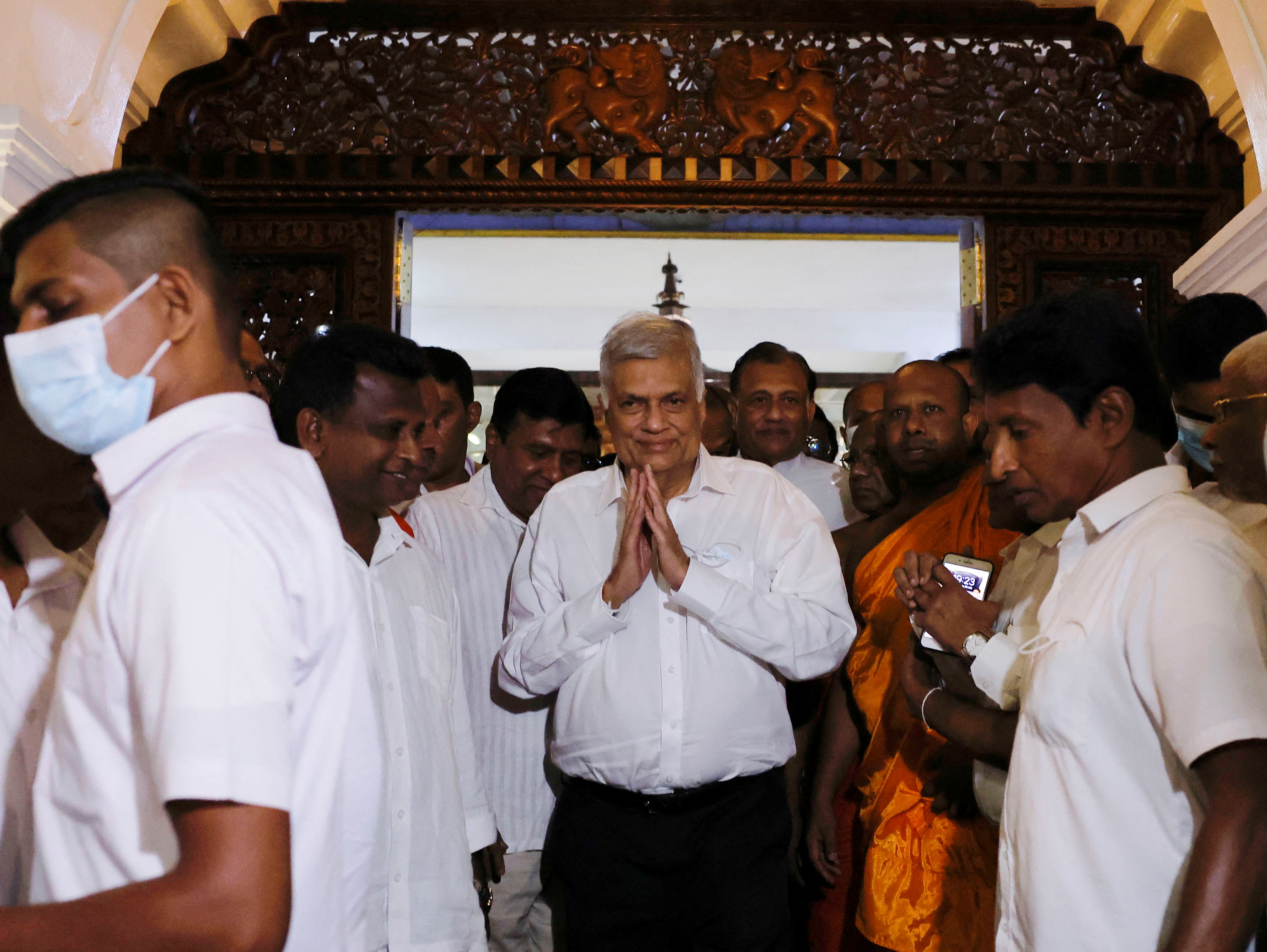 Ranil Wickremesinghe who has been elected as the Eighth Executive President under the Constitution leaves a Buddhist temple,