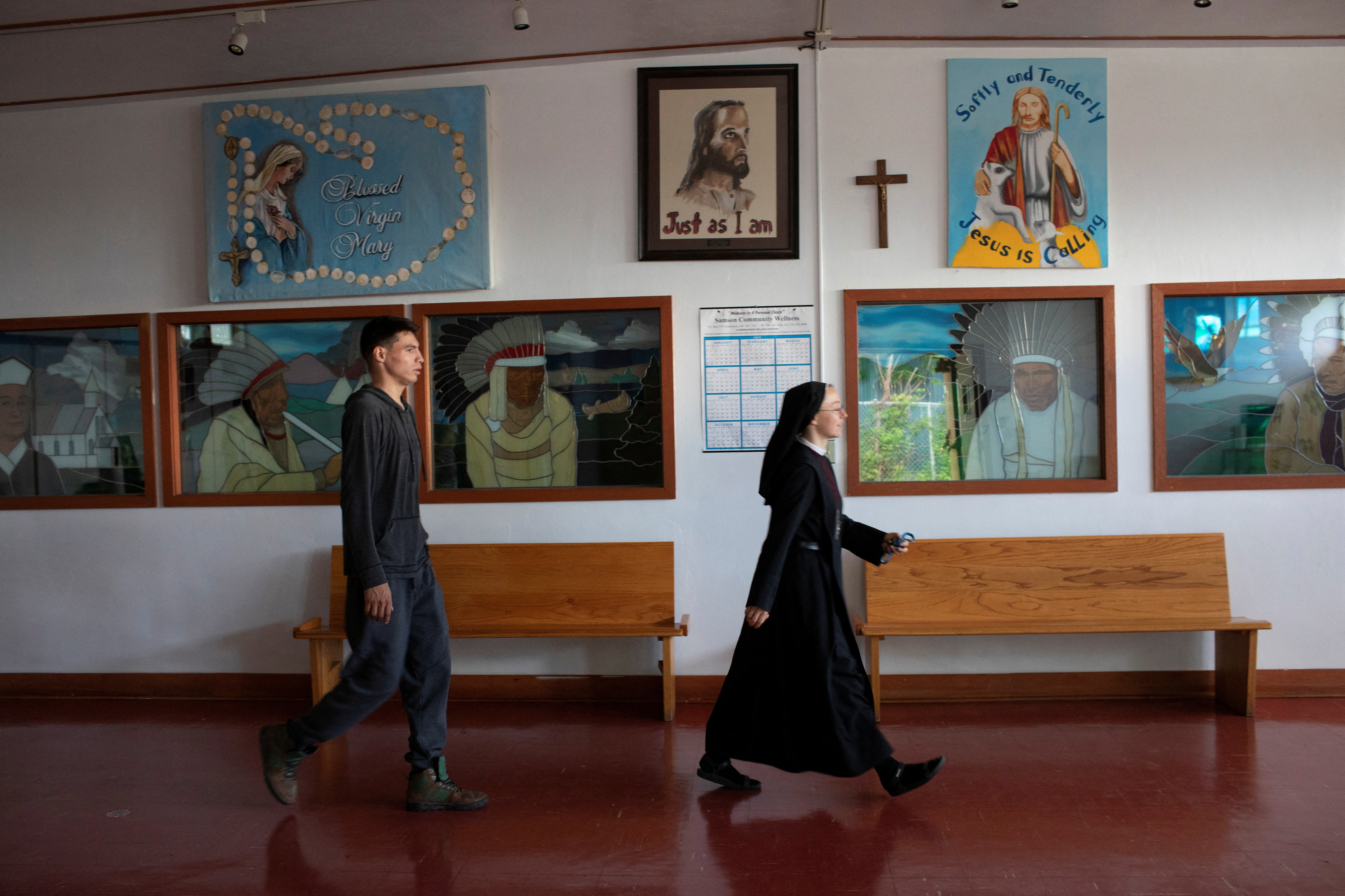 Sister Monika from the Congregation of Sisters of Merciful Jesus and Marcel Soosay prepare the church ahead of the visit of Pope Francis to Our Lady of Seven Sorrows in Maskwacis, Alberta, Canada
