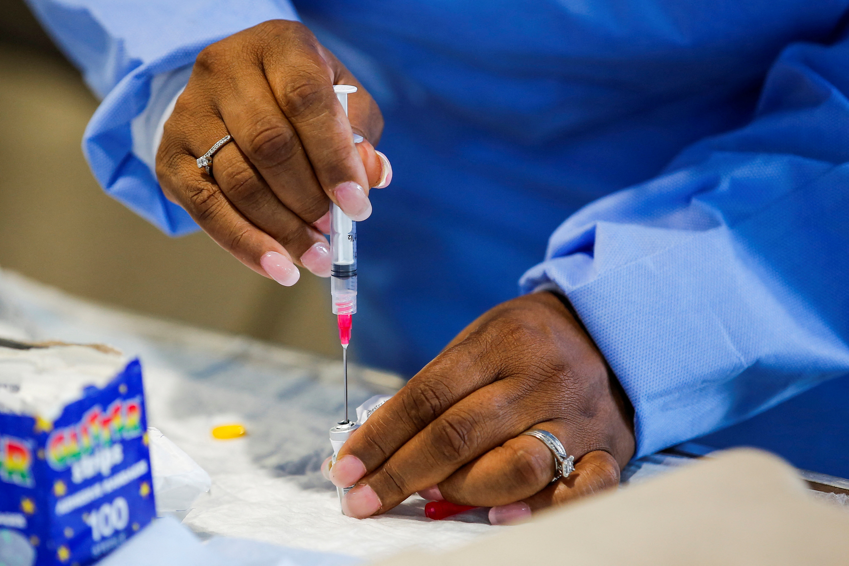 A staff member of the Westchester Medical Center prepares a monkeypox vaccine in a drive-through monkeypox vaccination point at the Westchester Medical Center in Valhalla, New York, U.S., July 28, 2022. REUTERS/Eduardo Munoz