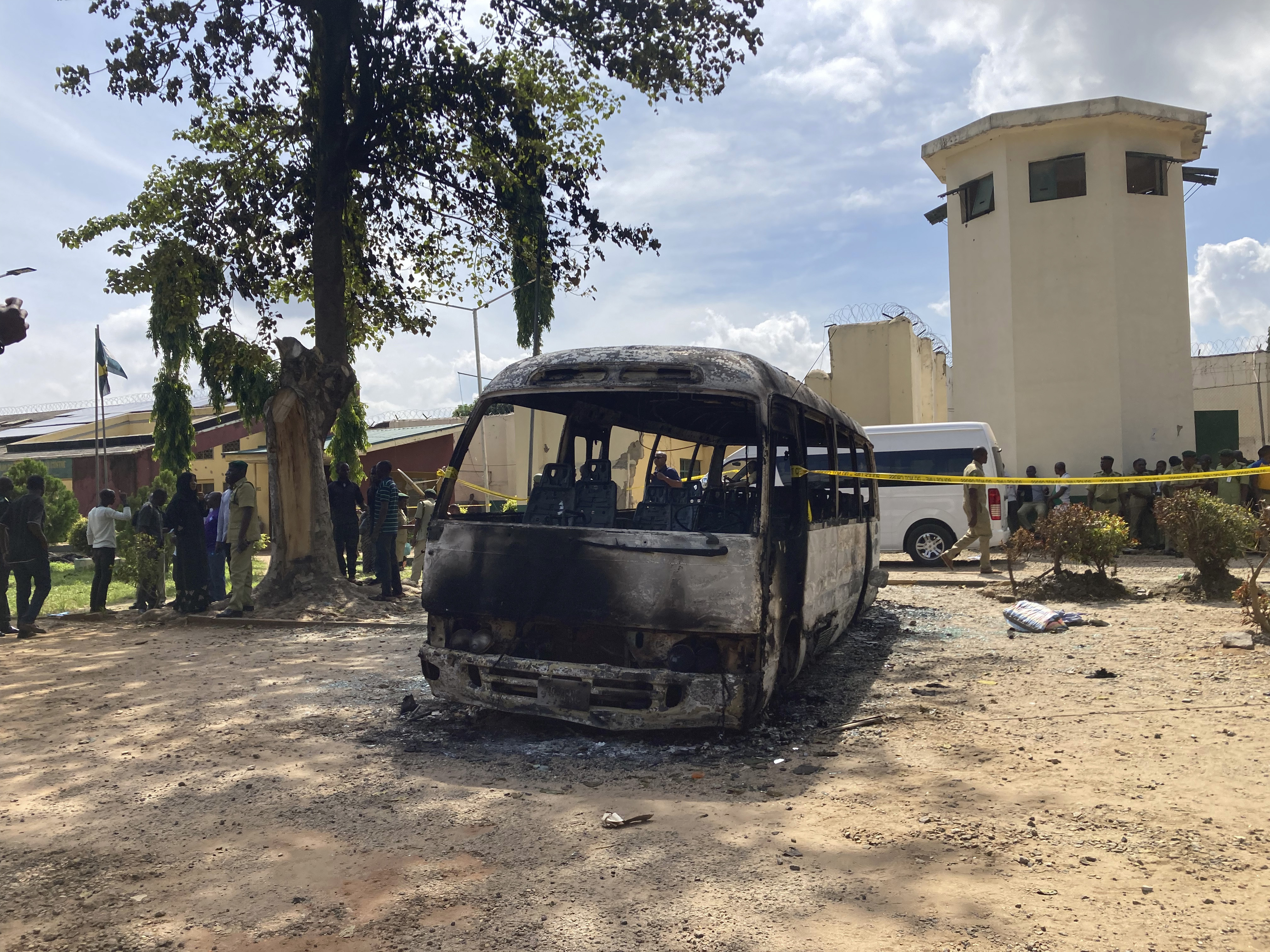 A burnt out bus is seen outside the Kuje prison following anl attack in Kuje, Nigeria,