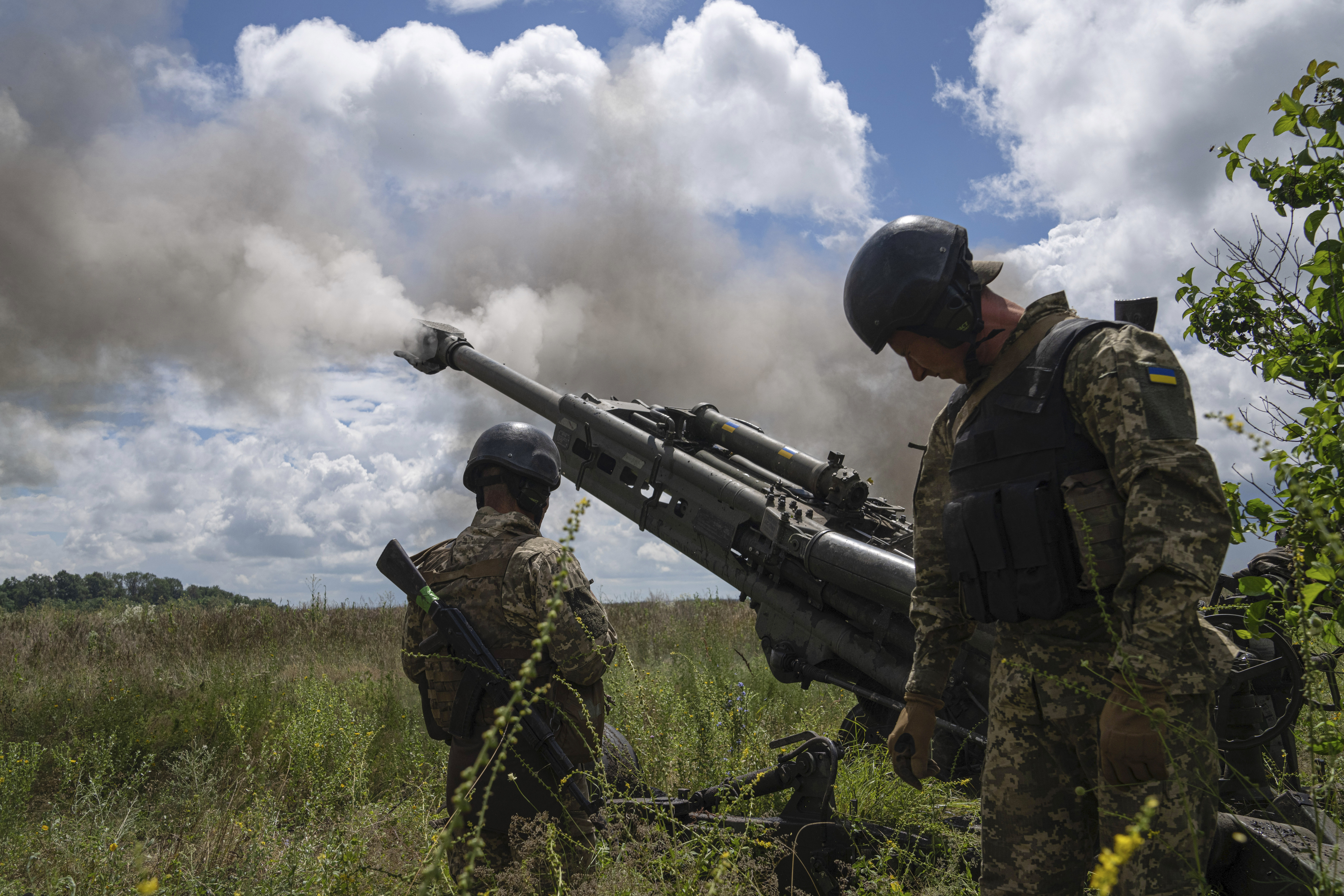 Ukrainian servicemen fire at Russian positions from a US- supplied M777 howitzer in Kharkiv region, Ukraine