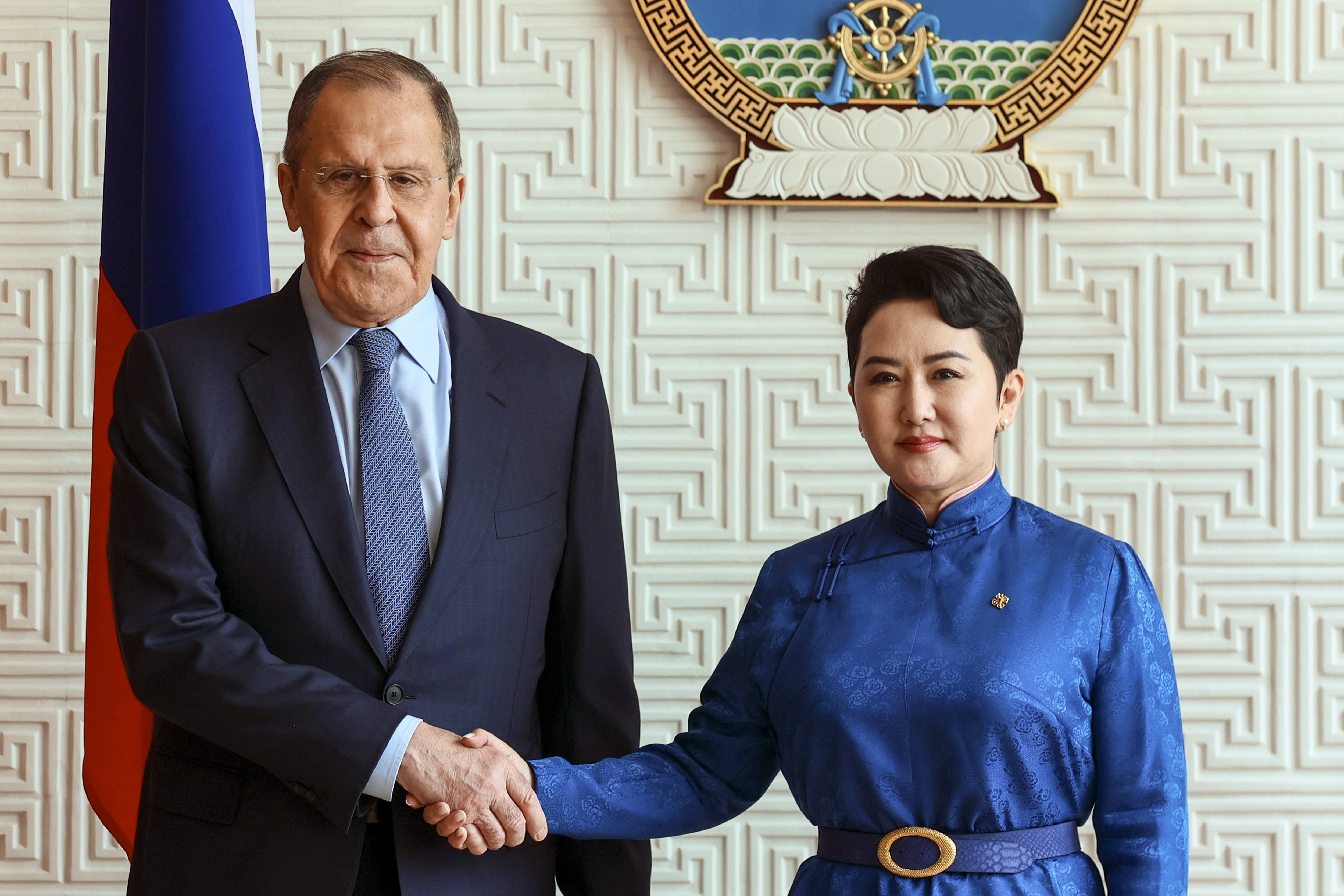 Mongolian Foreign Minister Batmunkh Battsetseg shakes hands with Russian Foreign Minister Sergey Lavrov prior to their talks in Ulaanbaatar, Mongolia.
