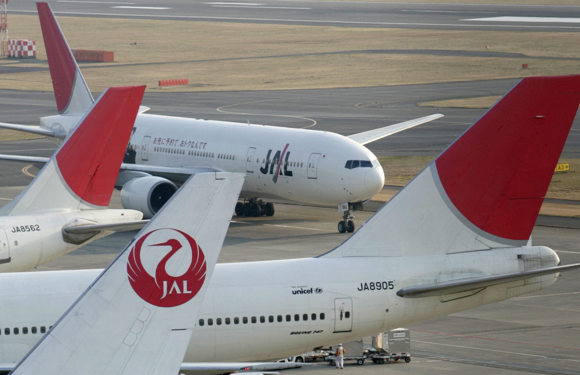 Planes on the tarmac of a Japanese airport.
