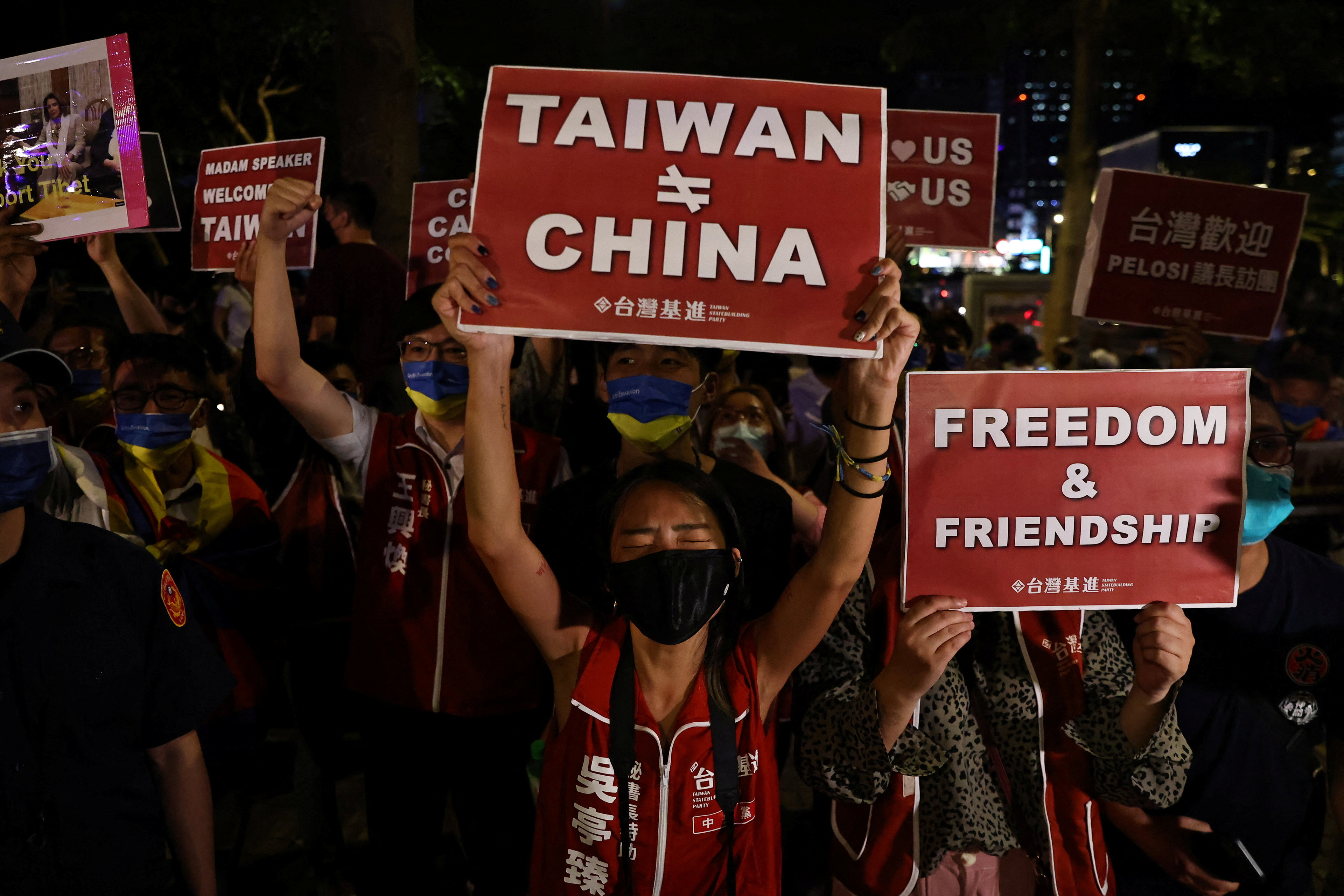Demonstrators hold signs during a gathering in support of U.S. House of Representatives Speaker Nancy Pelosi's expected visit, in Taipei, Taiwan August 2, 2022.