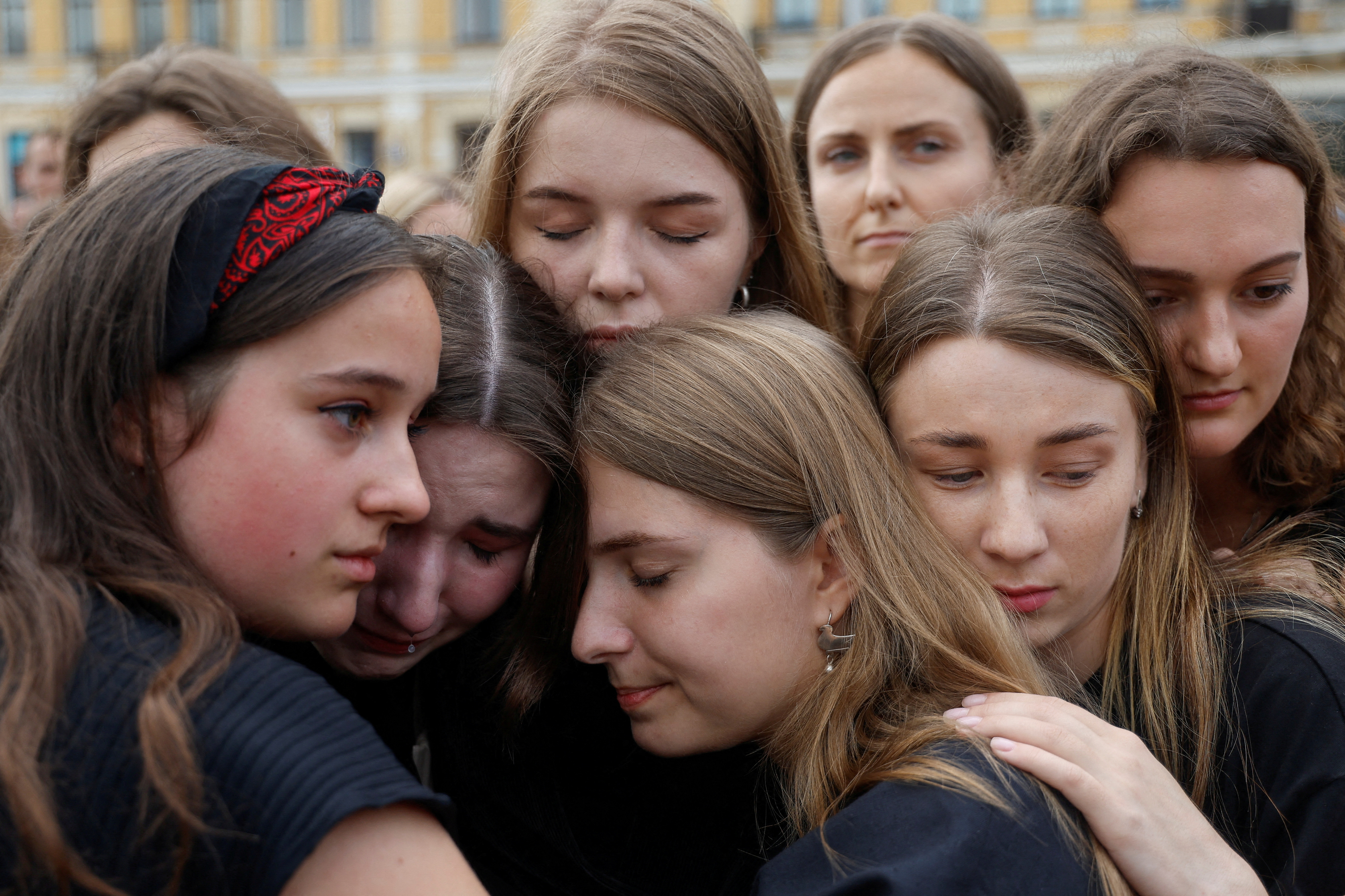 Women react during a rally of relatives and friends of defenders of the Azovstal Iron and Steel Works in Mariupol, demanding to recognise Russia as a state sponsor of terrorism after killing Ukrainian prisoners of war (POWs) in a prison in Olenivka, outside of Donetsk, as Russia's attack on Ukraine continues, in Kyiv, Ukraine August 4, 2022. REUTERS/Valentyn Ogirenko TPX IMAGES OF THE DAY