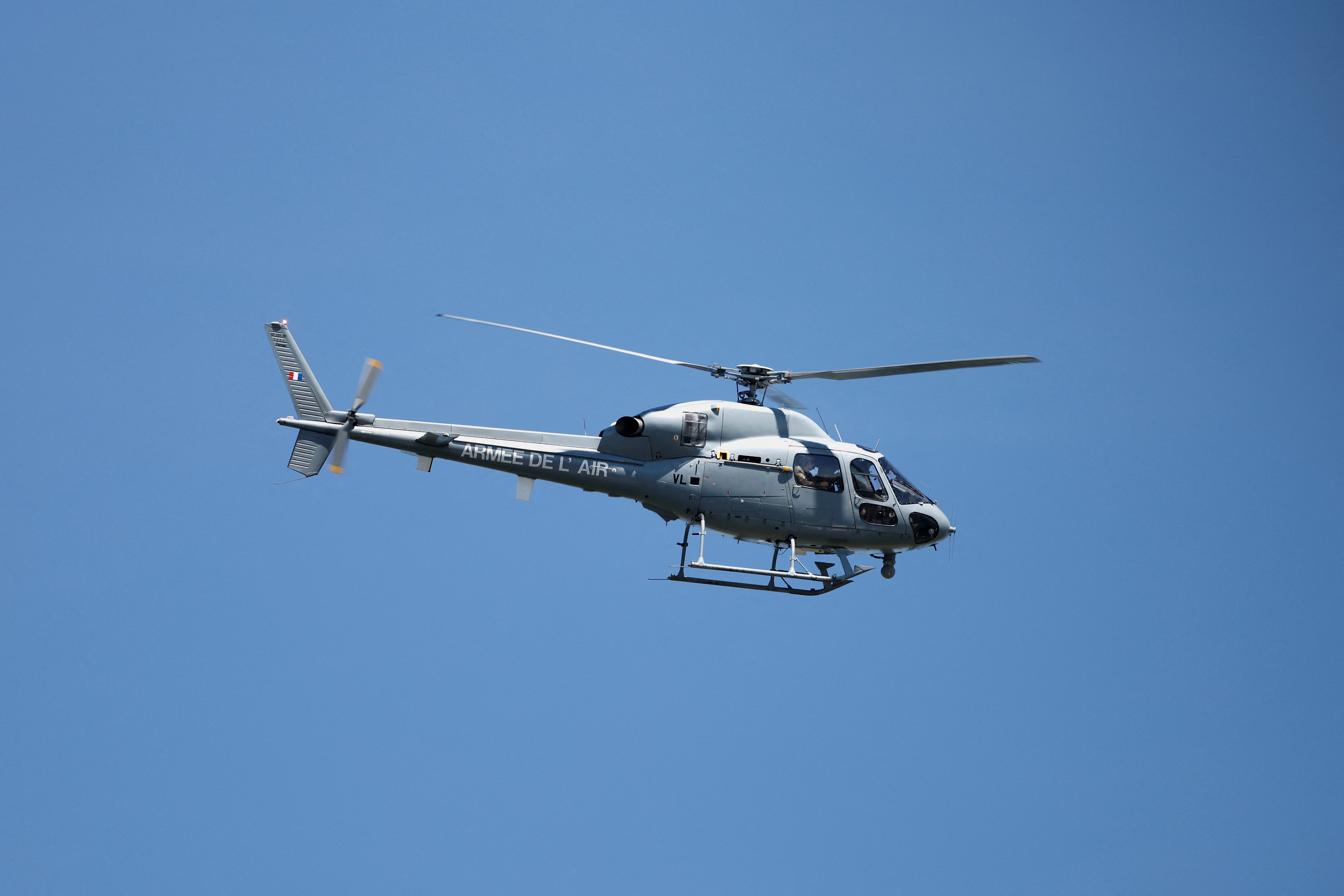 An AS555 Fennec helicopter of the French Air Force flies over the Notre-Dame-de-la-Garenne lock as French authorities try to rescue a Beluga whale on the Seine river in Saint-Pierre-la-Garenne, France, August 8, 2022. REUTERS/Benoit Tessier