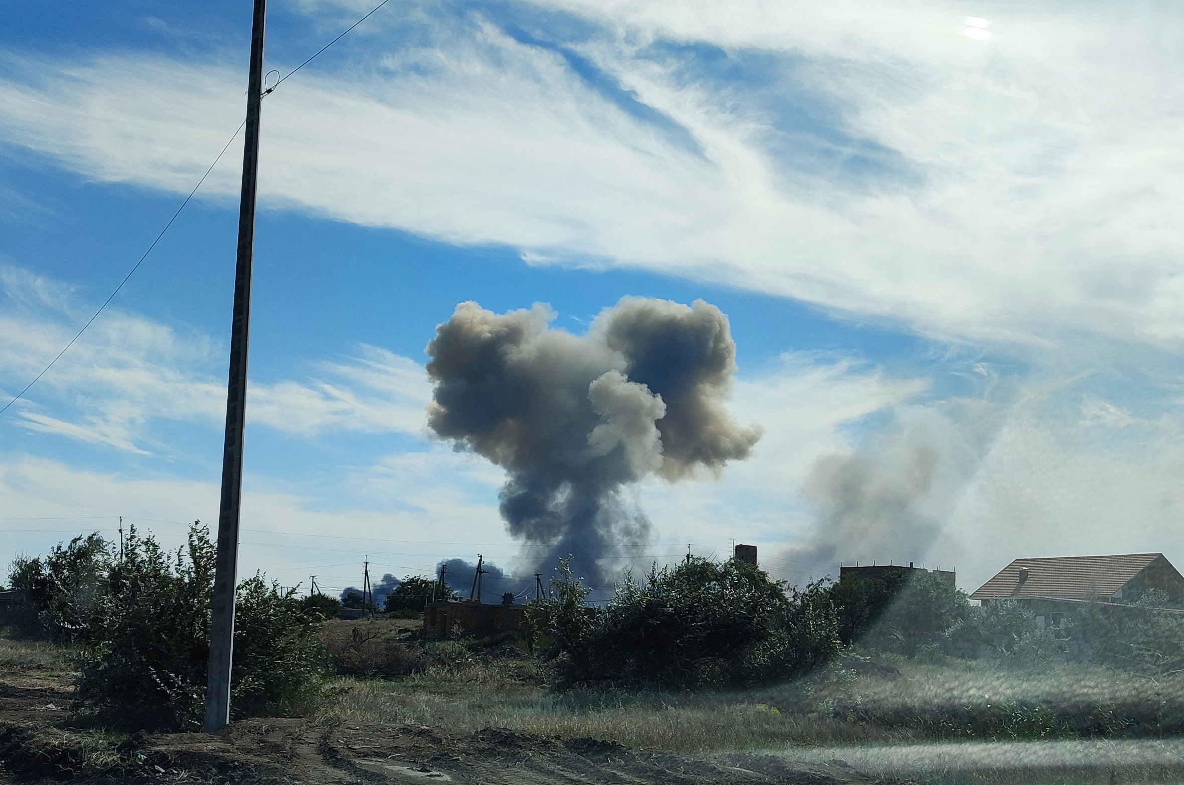 Smoke rises after explosions were heard from the direction of a Russian military airbase near Novofedorivka, Crimea