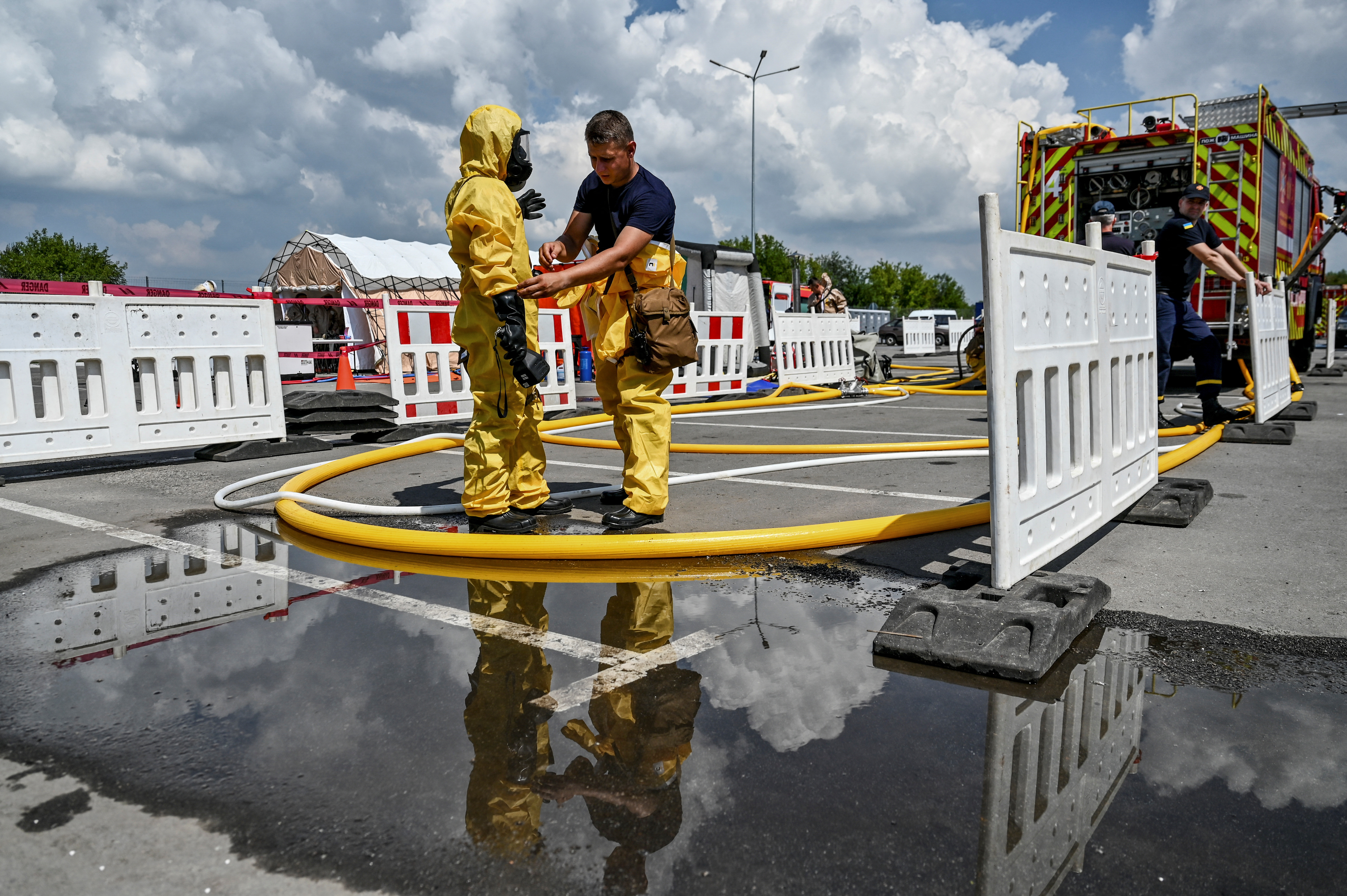 Members of the State Emergency Service prepare for nuclear disaster response drills amid shelling of the Zaporizhzhia Nuclear Power Plant in Zaporizhzhia, Ukraine.