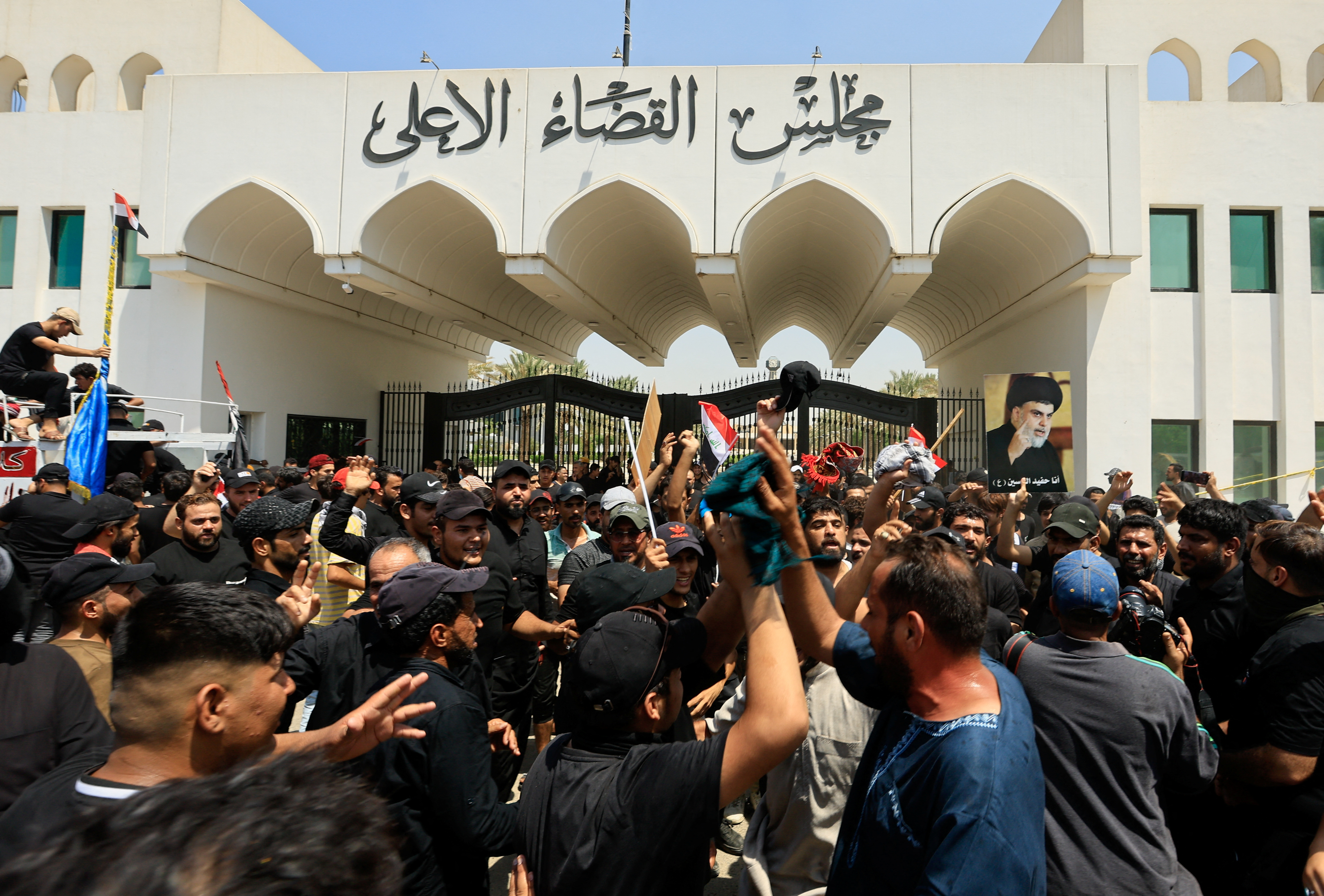 Supporters of Iraqi populist leader Moqtada al-Sadr gather for a sit-in in front of the gate of Supreme Judicial Council of Iraq, amid political crisis in Baghdad, Iraq