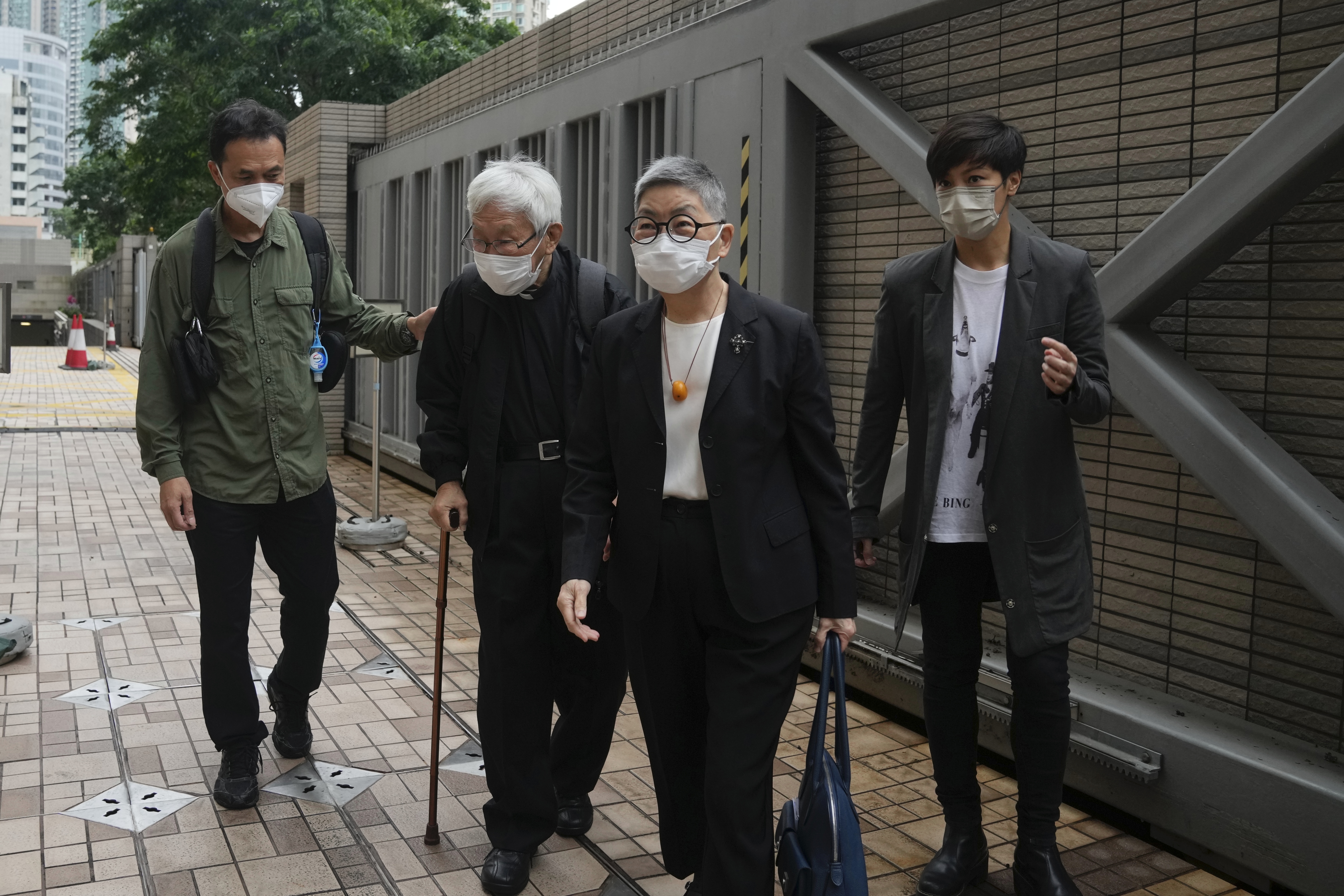 From left, Hong Kong scholar Hui Po-keung, Catholic Cardinal Joseph Zen, barrister Margaret Ng and singer Denise Ho arrive for an appearance at a court in Hong Kong