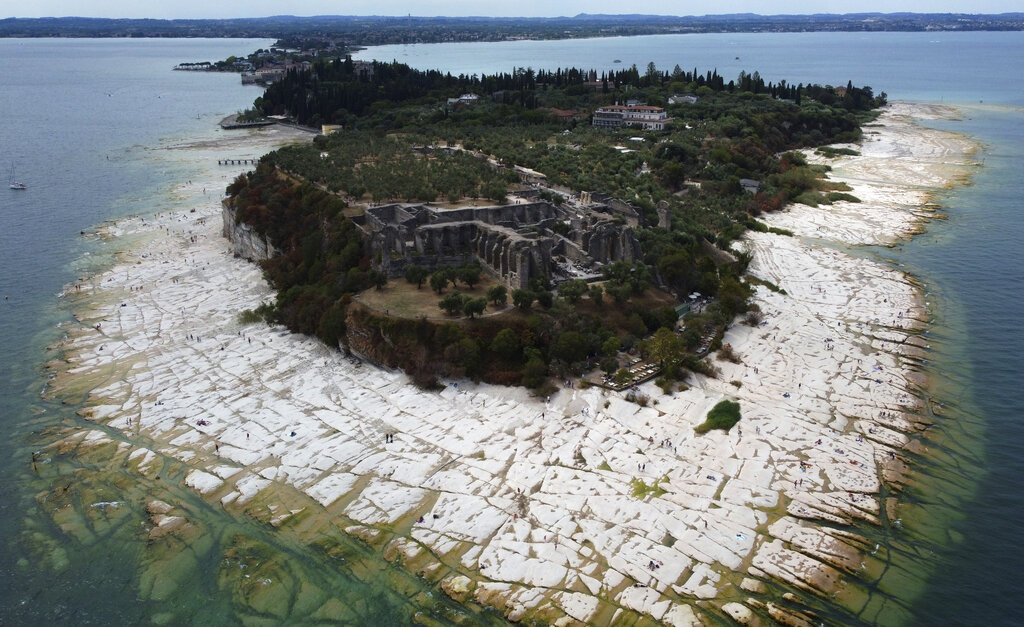 Lake Garda water level has dropped critically following severe drought, resulting in rocks to emerge around the Sirmione Peninsula on August 12, 2022