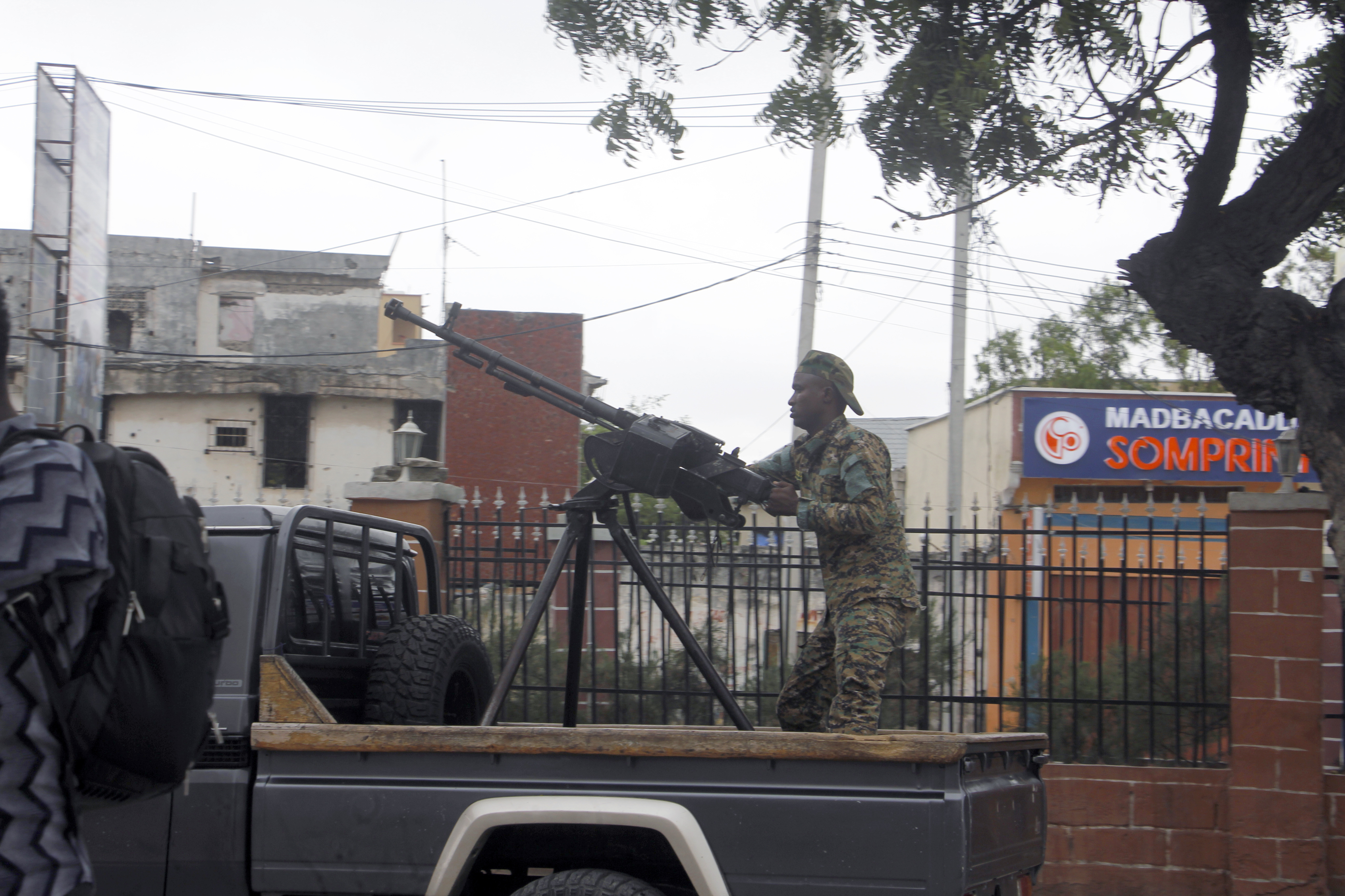 A soldier patrols outside the Hayat Hotel in Mogadishu, Somalia.