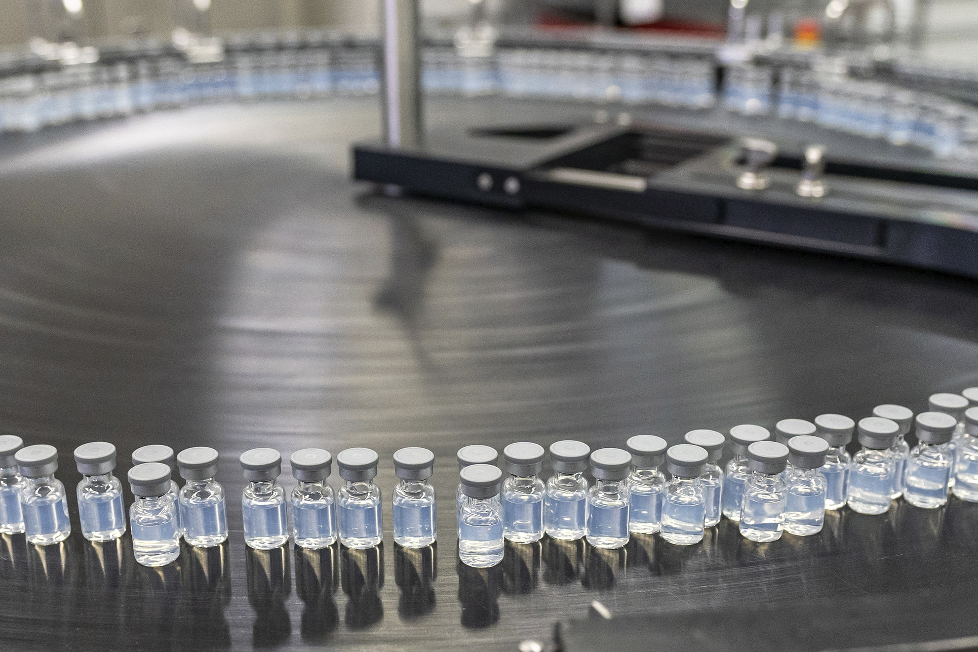 This August 2022 photo provided by Pfizer shows vials of the company's updated COVID-19 vaccine during production in Kalamazoo, United States [File: Pfizer/AP]